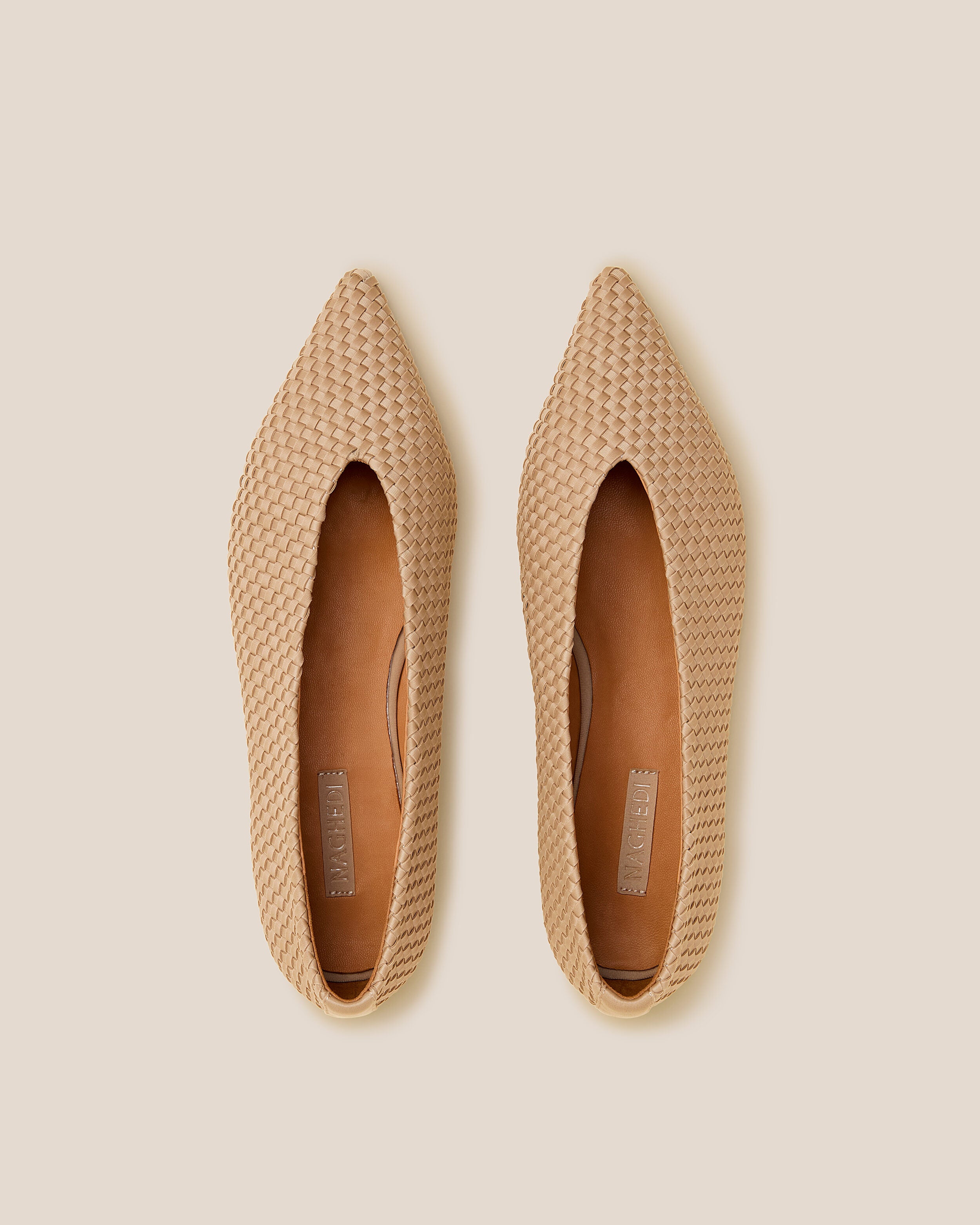 Top view of pair of Strada  in Camel showing the handwoven neoprene insole.