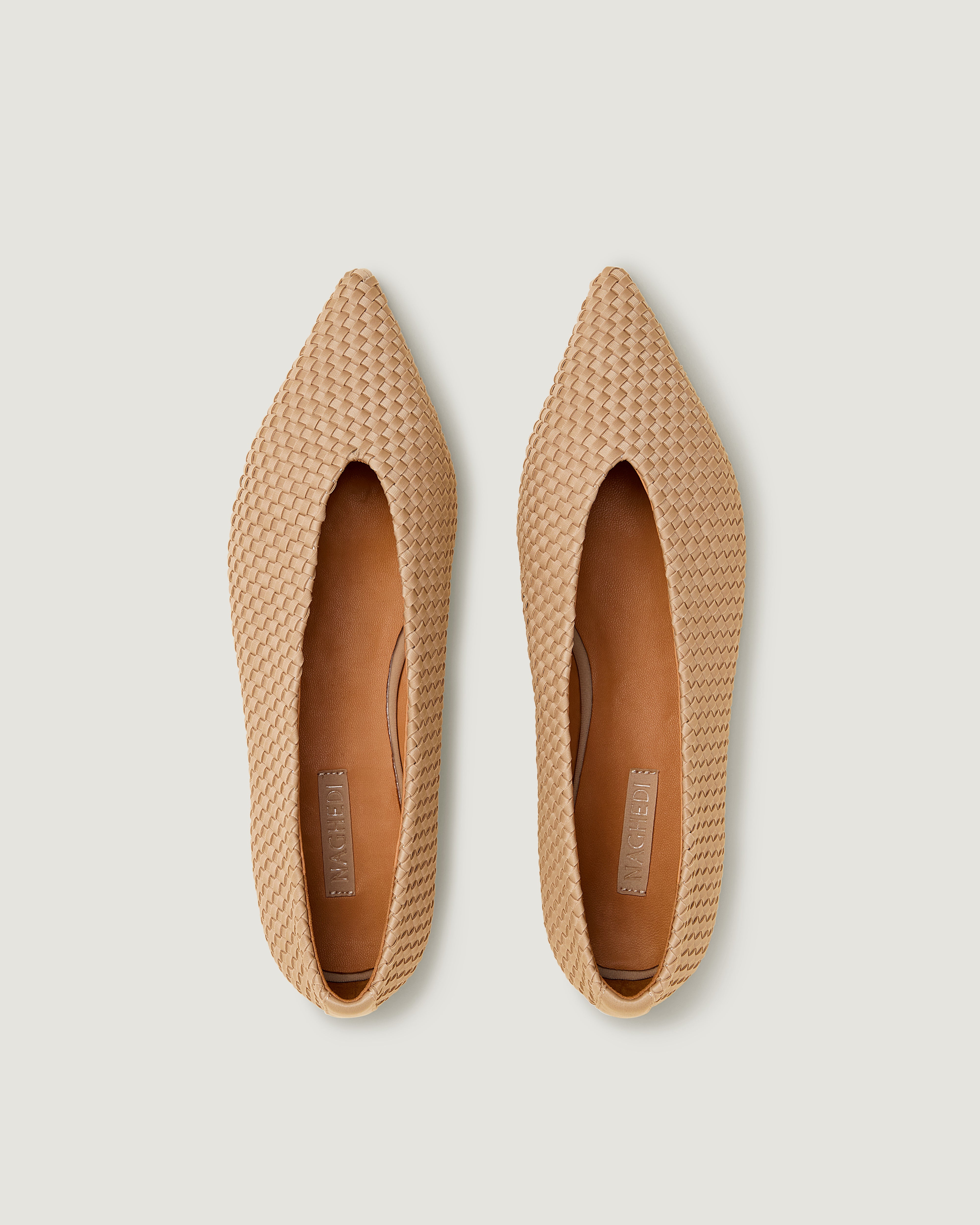 Top view of pair of Strada  in Camel showing the handwoven neoprene insole.
