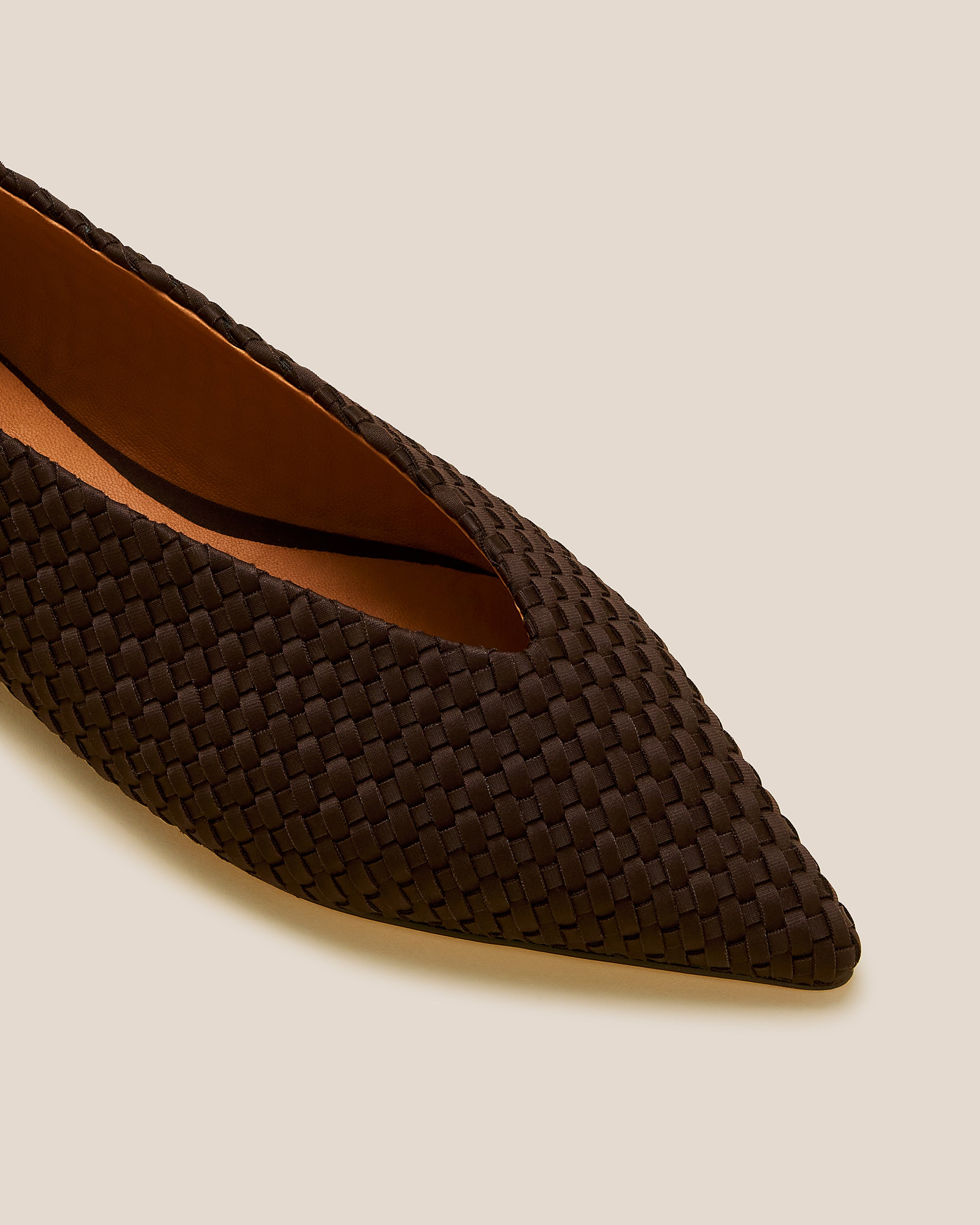 Close-up of Strada Flats in Chocolate showing its closed toe and pointed silhouette.
