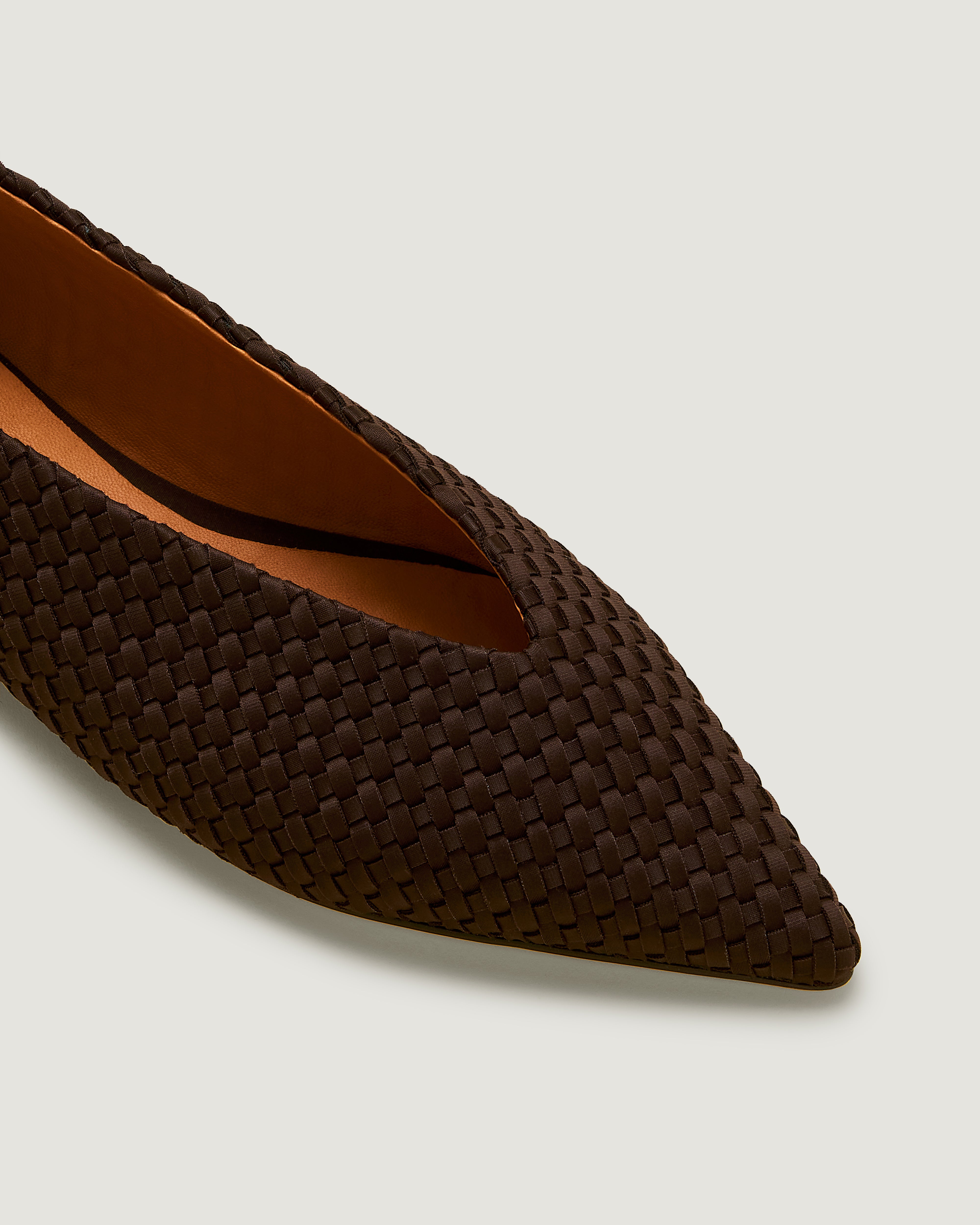Close-up of Strada  in Chocolate showing its closed toe and pointed silhouette.