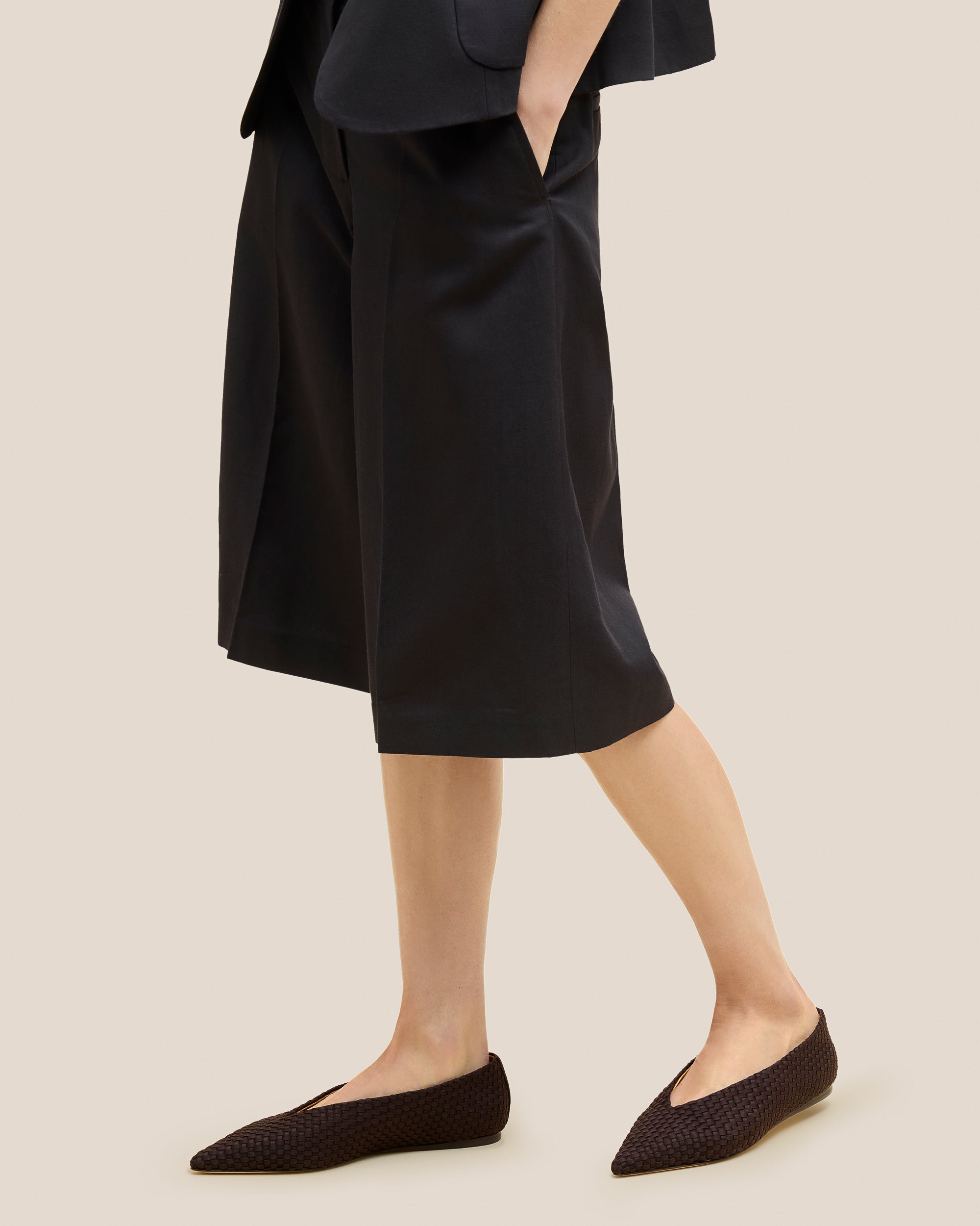Strada Flats in Chocolate shown on model.