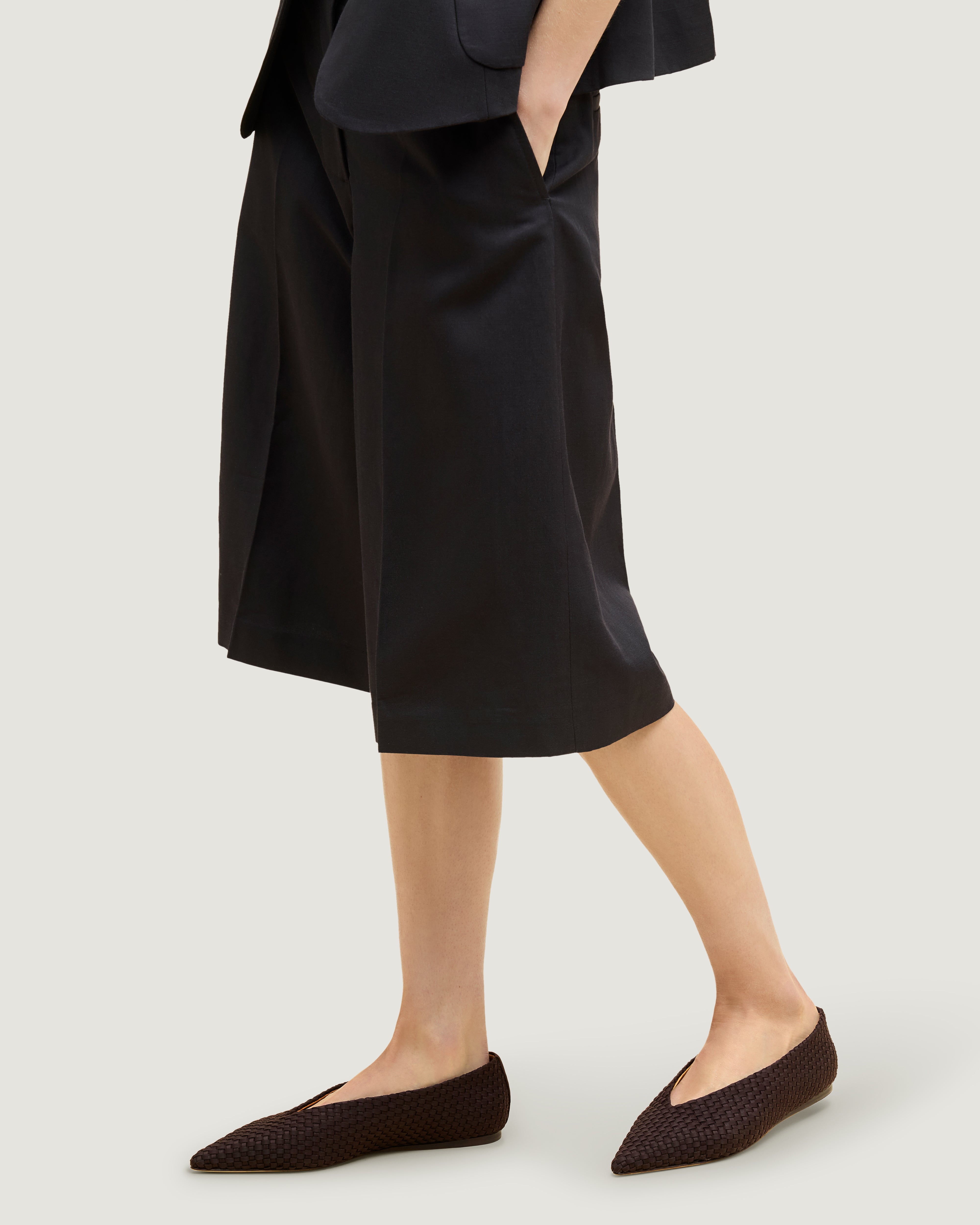 Strada Flat in Chocolate shown on model.