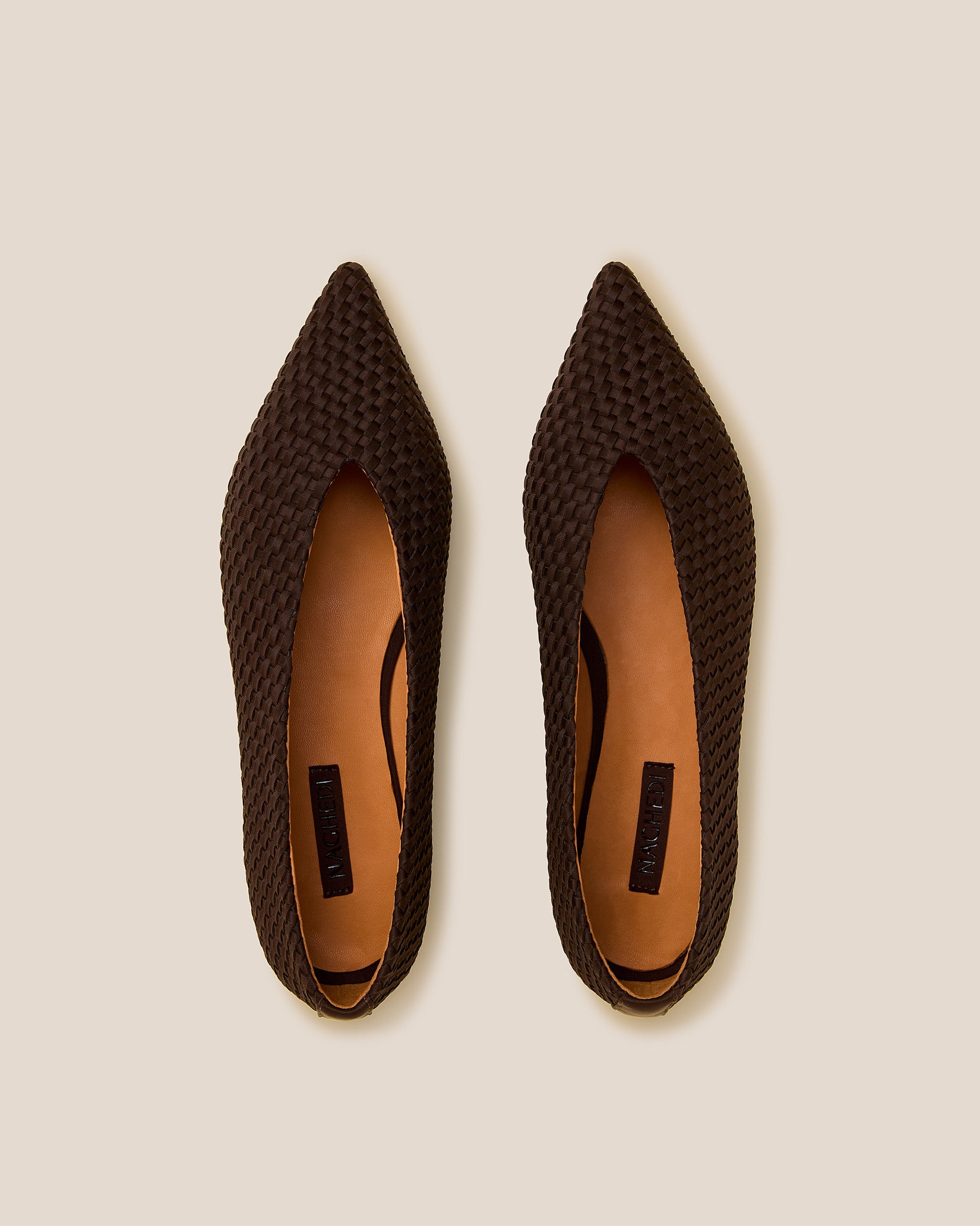 Top view of pair of Strada Flats in Chocolate showing the handwoven neoprene insole.