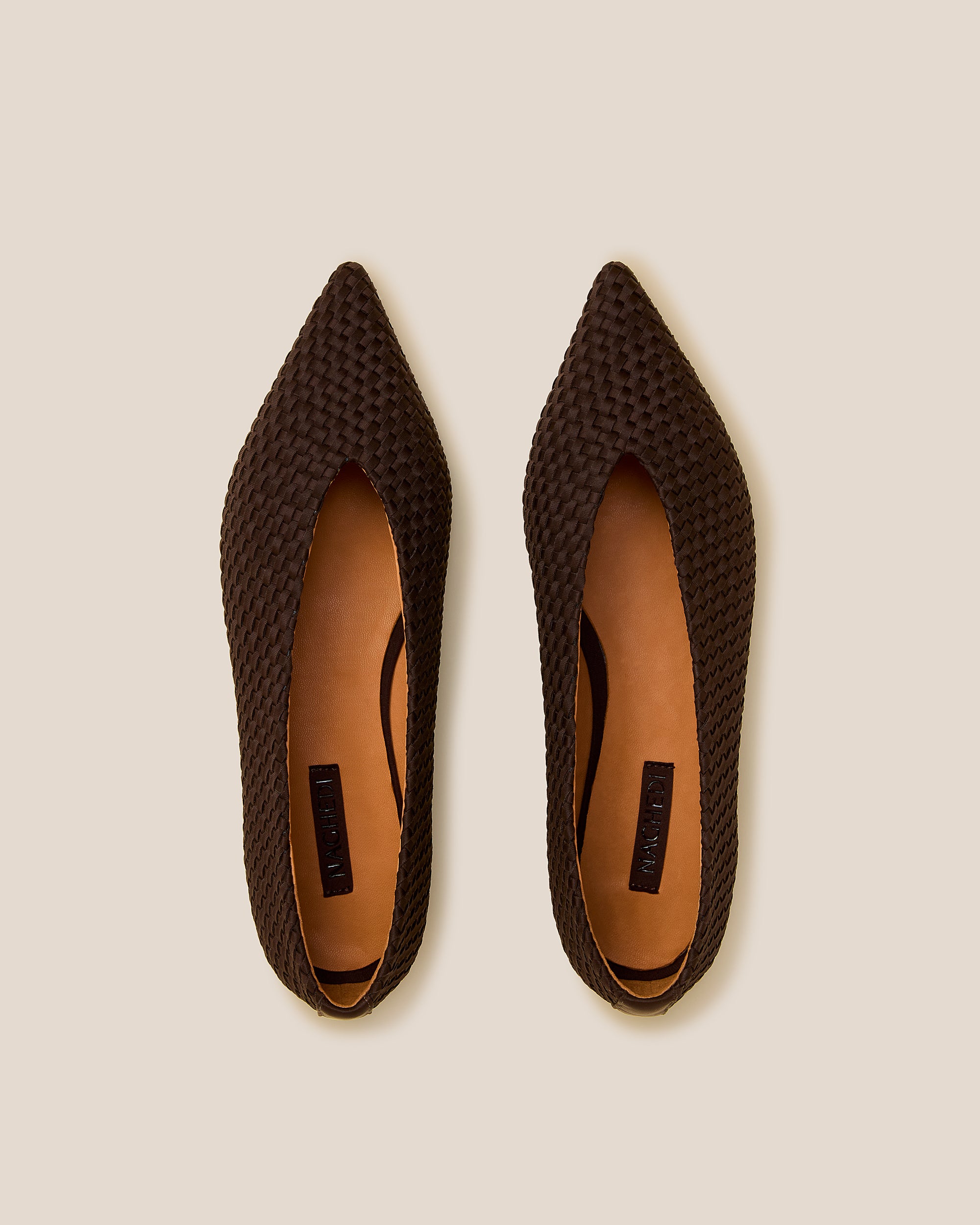 Top view of pair of Strada Flats in Chocolate showing the handwoven neoprene insole.