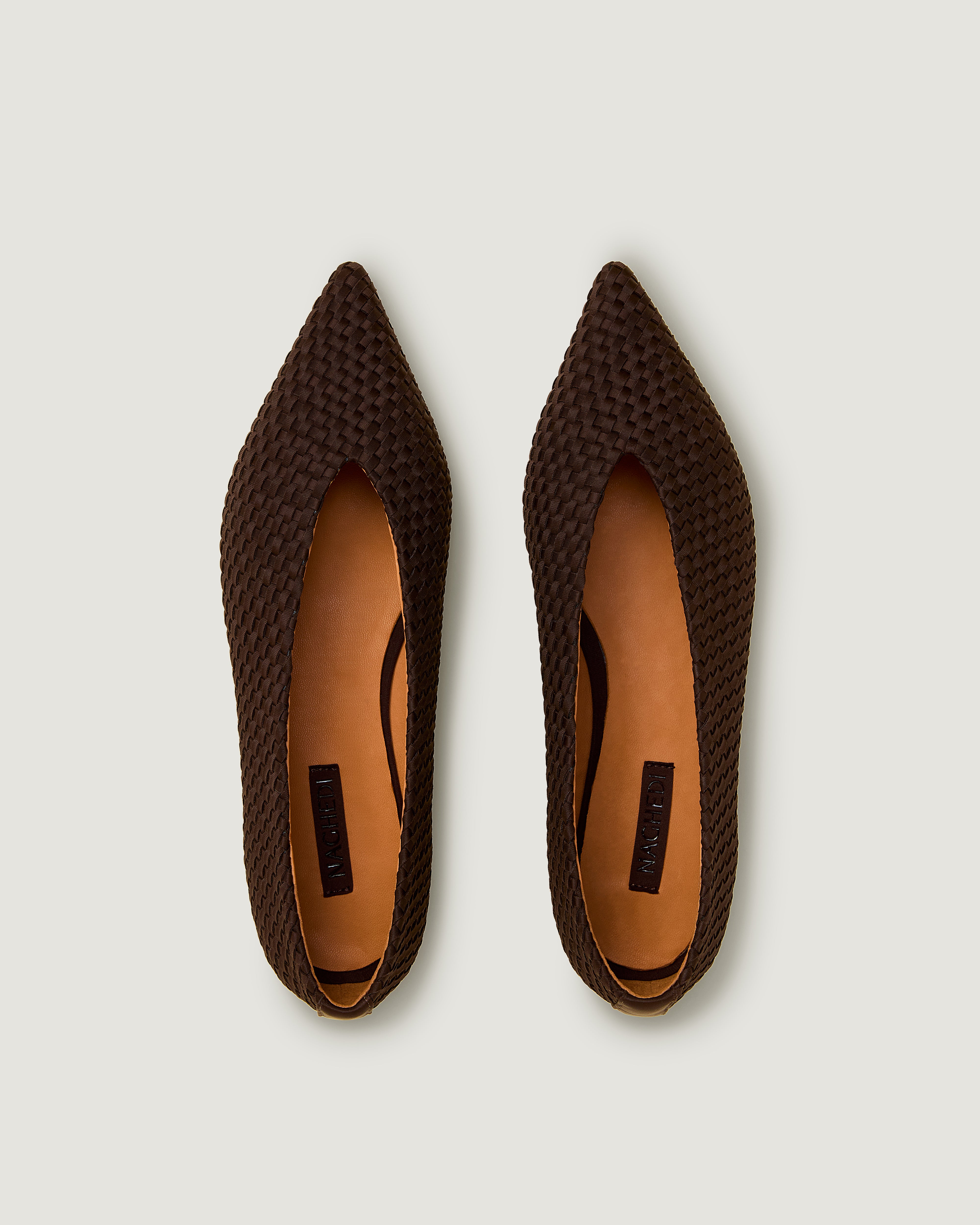 Top view of pair of Strada  in Chocolate showing the handwoven neoprene insole.