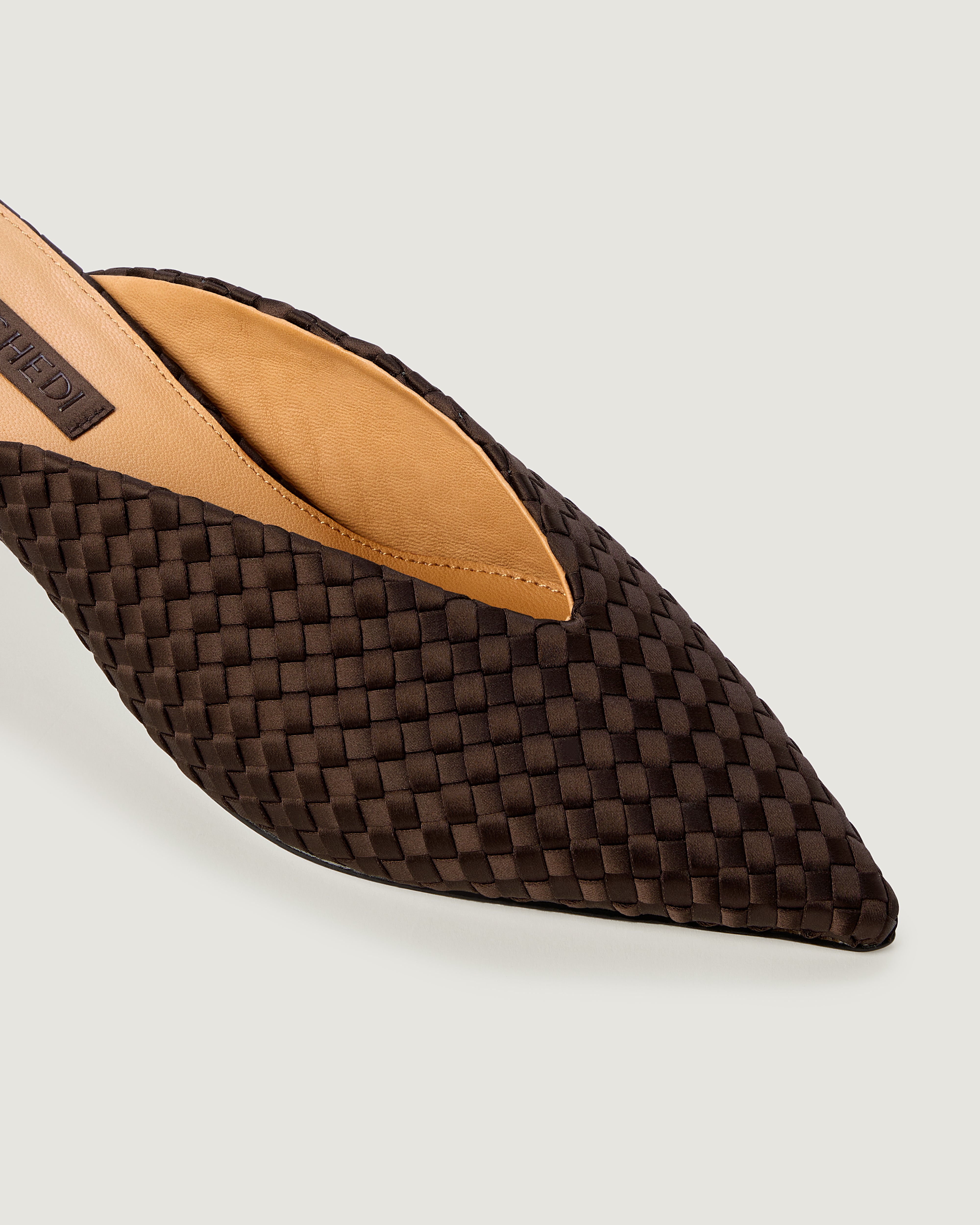 Close-up of Strada in Chocolate showing its closed toe and pointed silhouette.