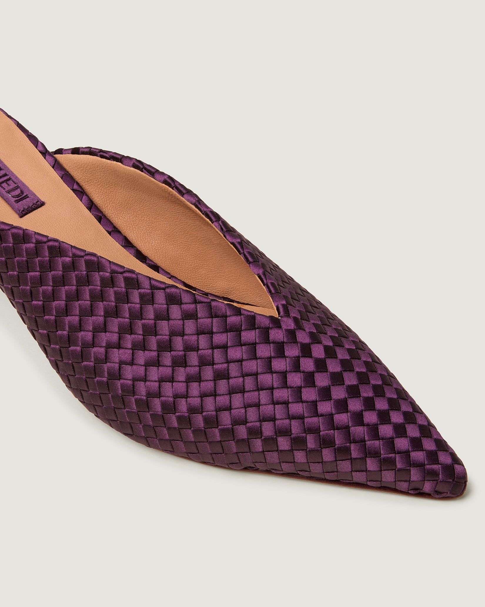 Close-up of Strada Satin Kitten Heel in Currant showing its closed toe and pointed silhouette.