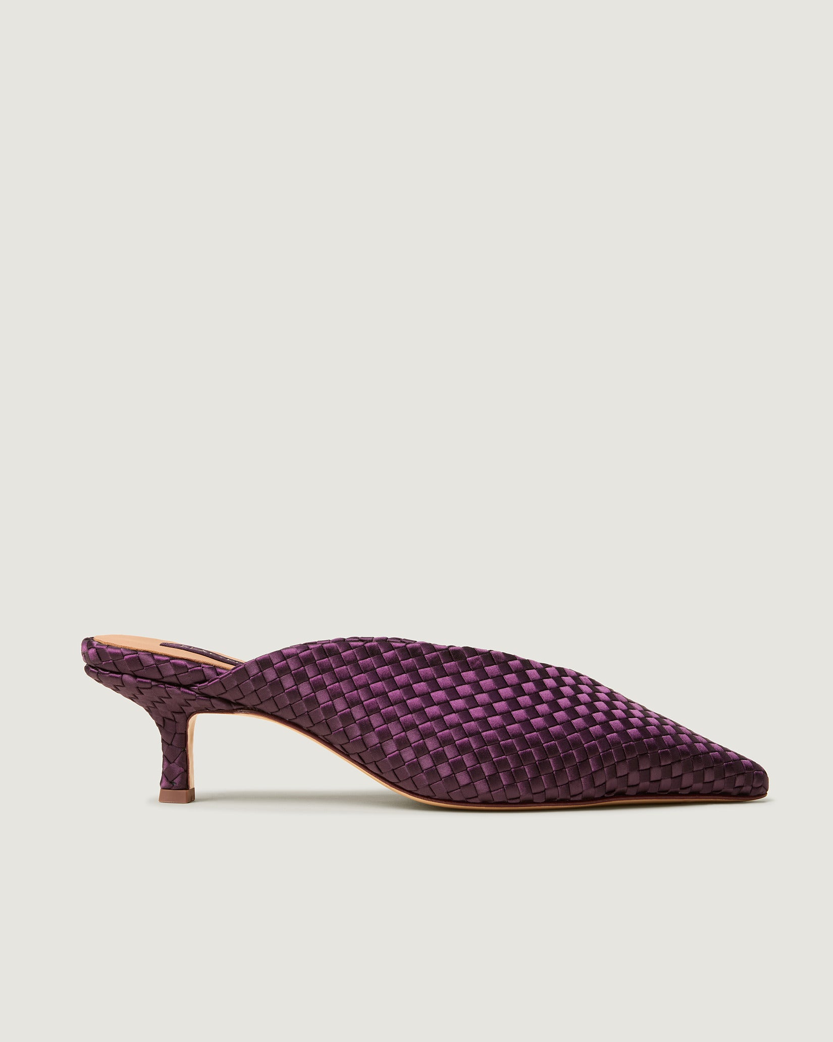 Side view of Strada Satin Kitten Heel in Currant, a deep purple tone, featuring a closed toe and pointed silhouette.