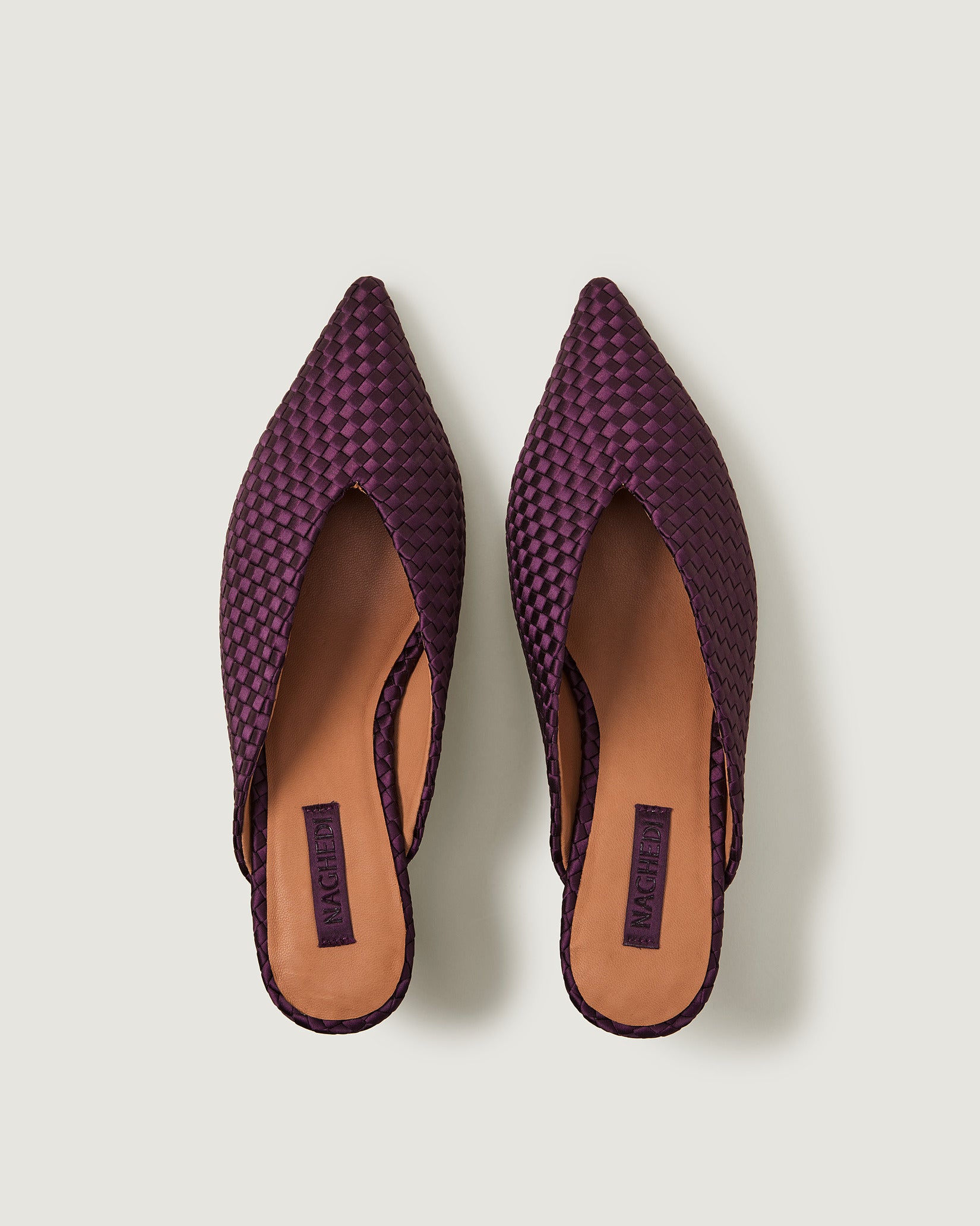 Top view of pair of Strada Satin Kitten Heel in Currant showing the handwoven neoprene insole.