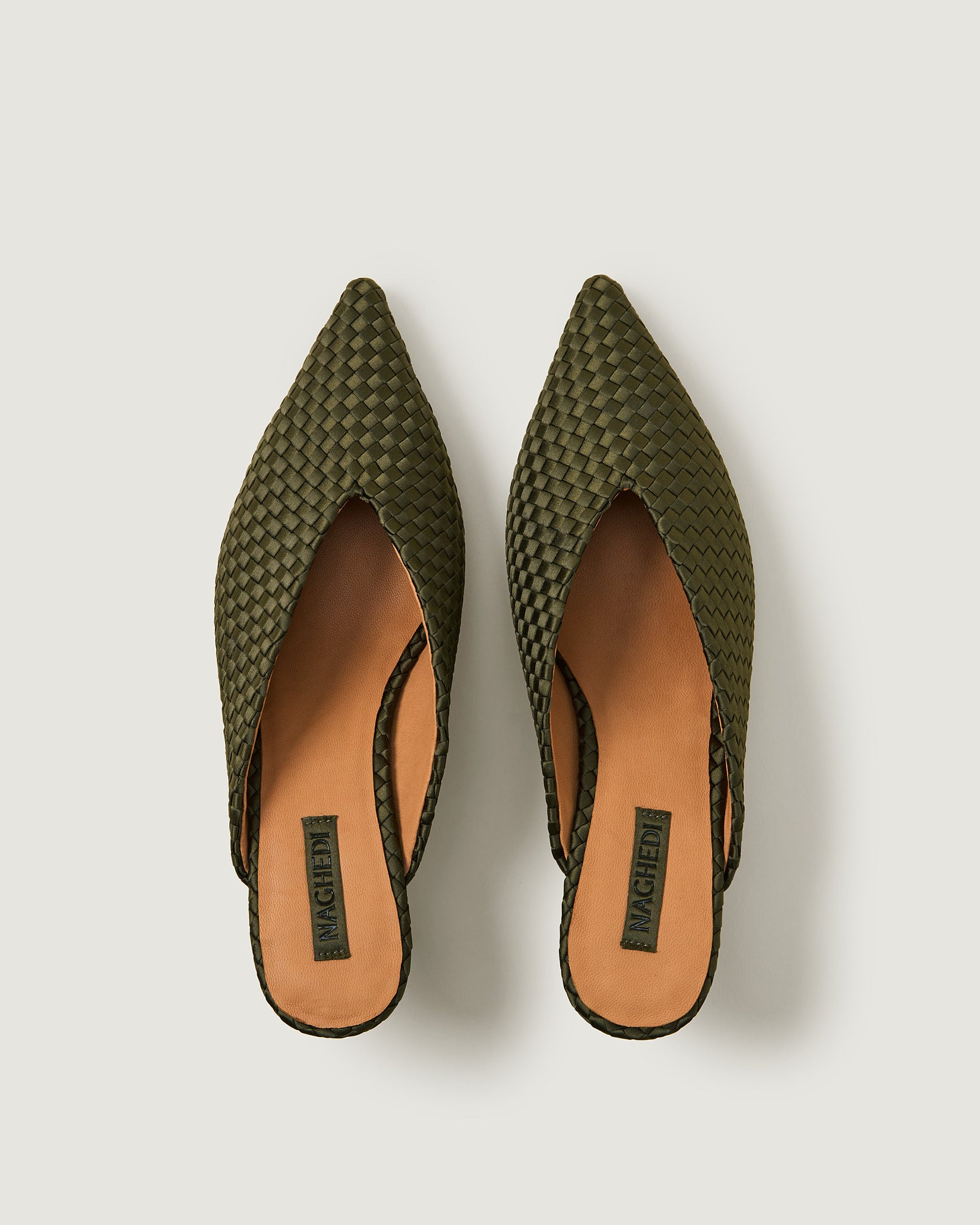Top view of pair of Strada Satin Kitten Heel in Juniper showing the handwoven neoprene insole.