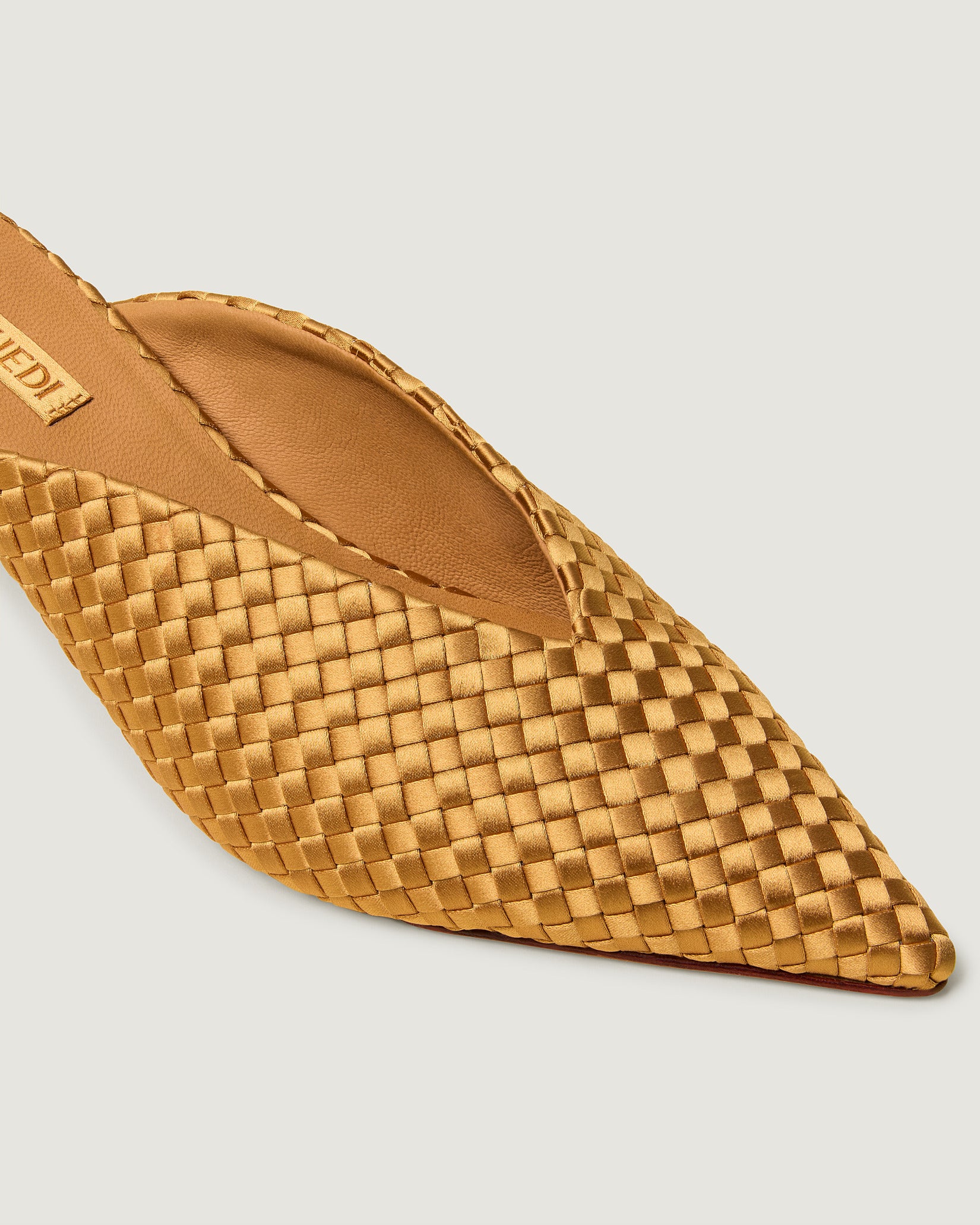 Close-up of Strada Satin Kitten Heel in Ore showing its closed toe and pointed silhouette.