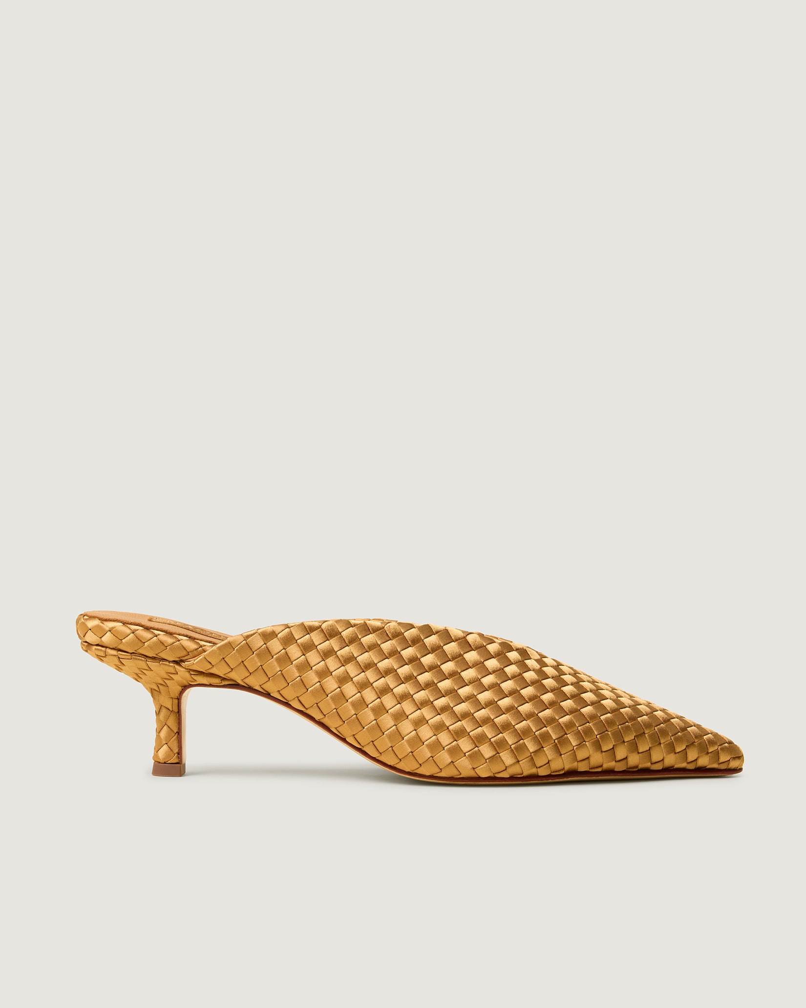 Side view of Strada Satin Kitten Heel in Ore, a golden yellow tone, featuring a closed toe and pointed silhouette.