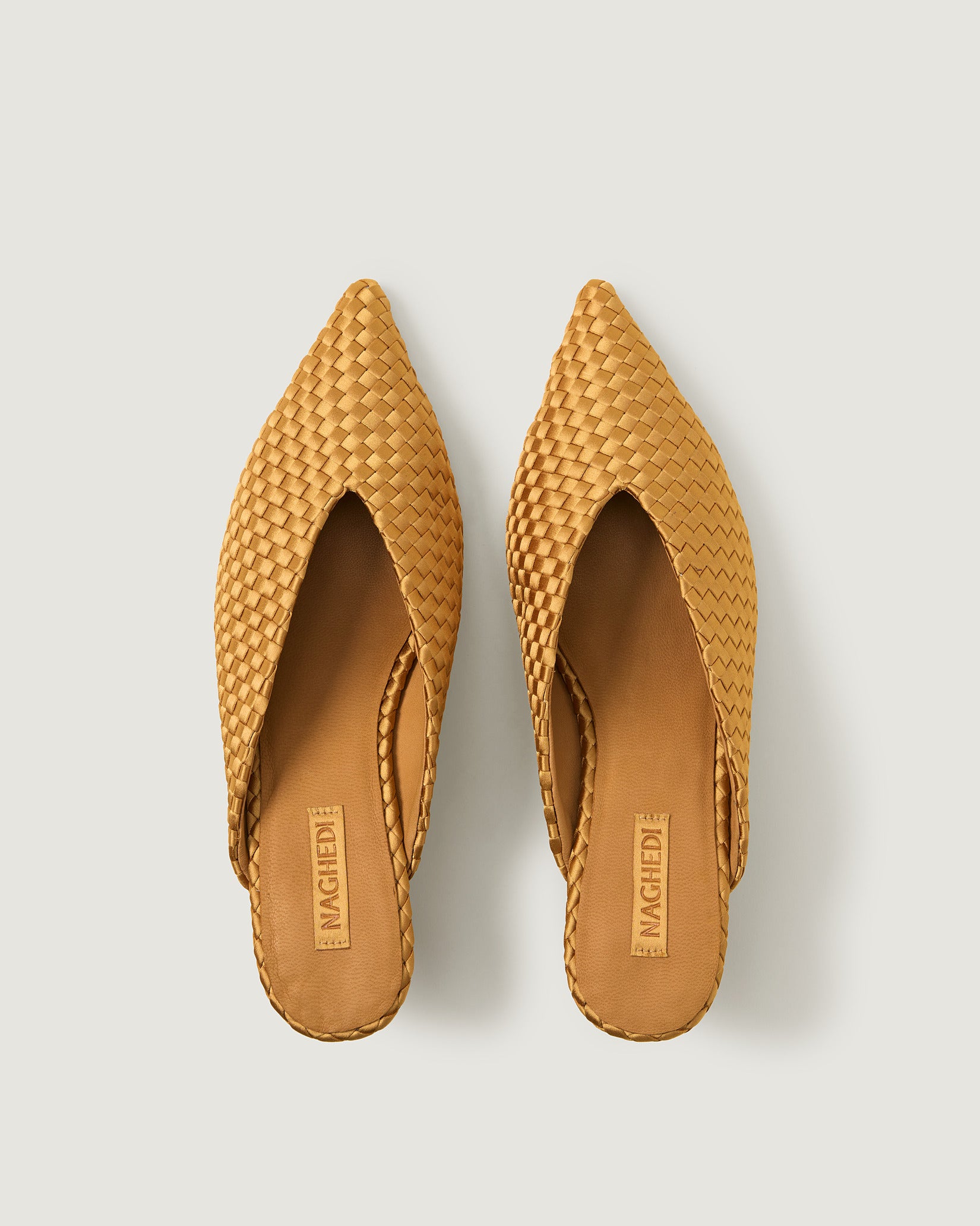 Top view of pair of Strada Satin Kitten Heel in Ore showing the handwoven neoprene insole.