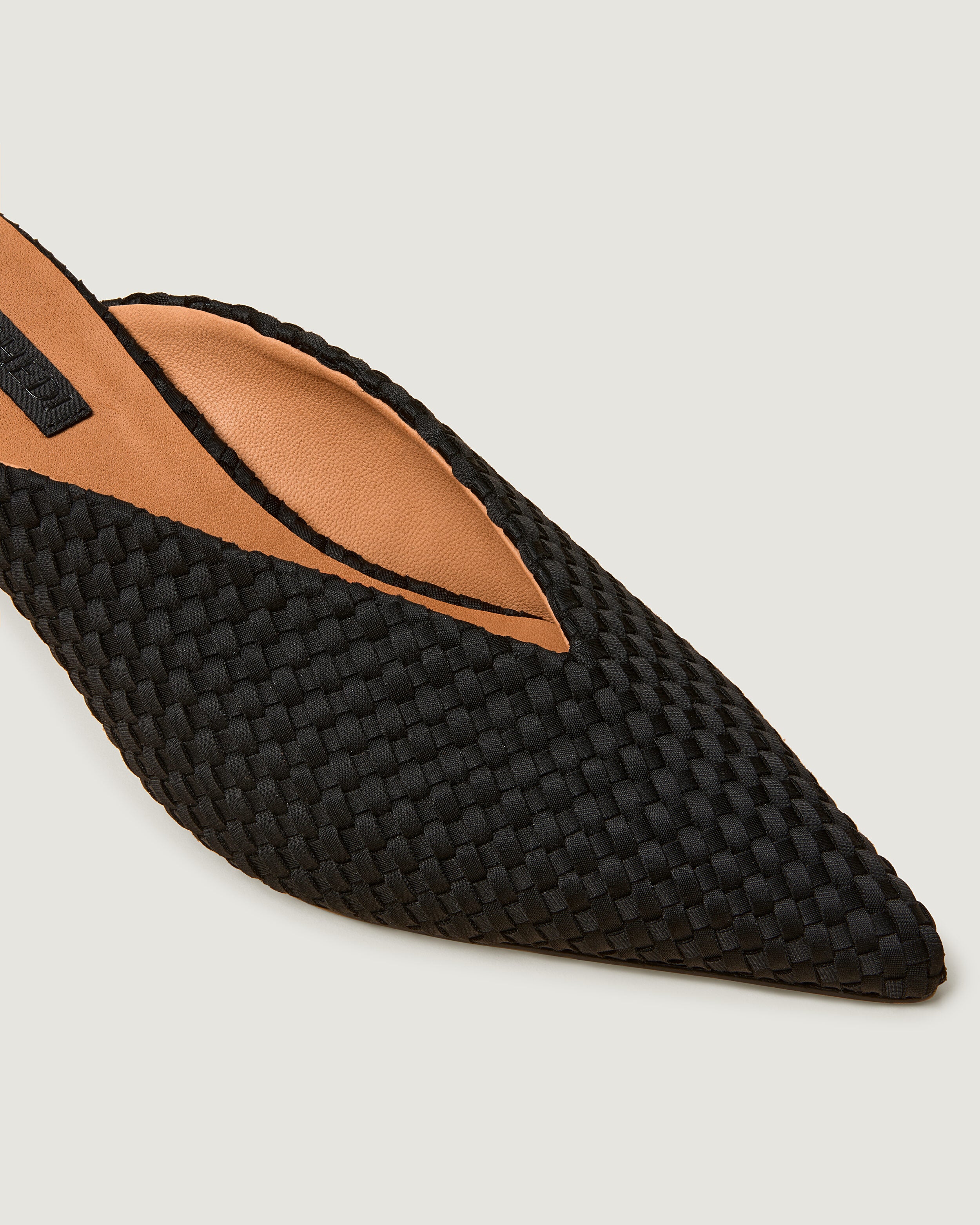 Close-up of Strada  in Onyx showing its closed toe and pointed silhouette.