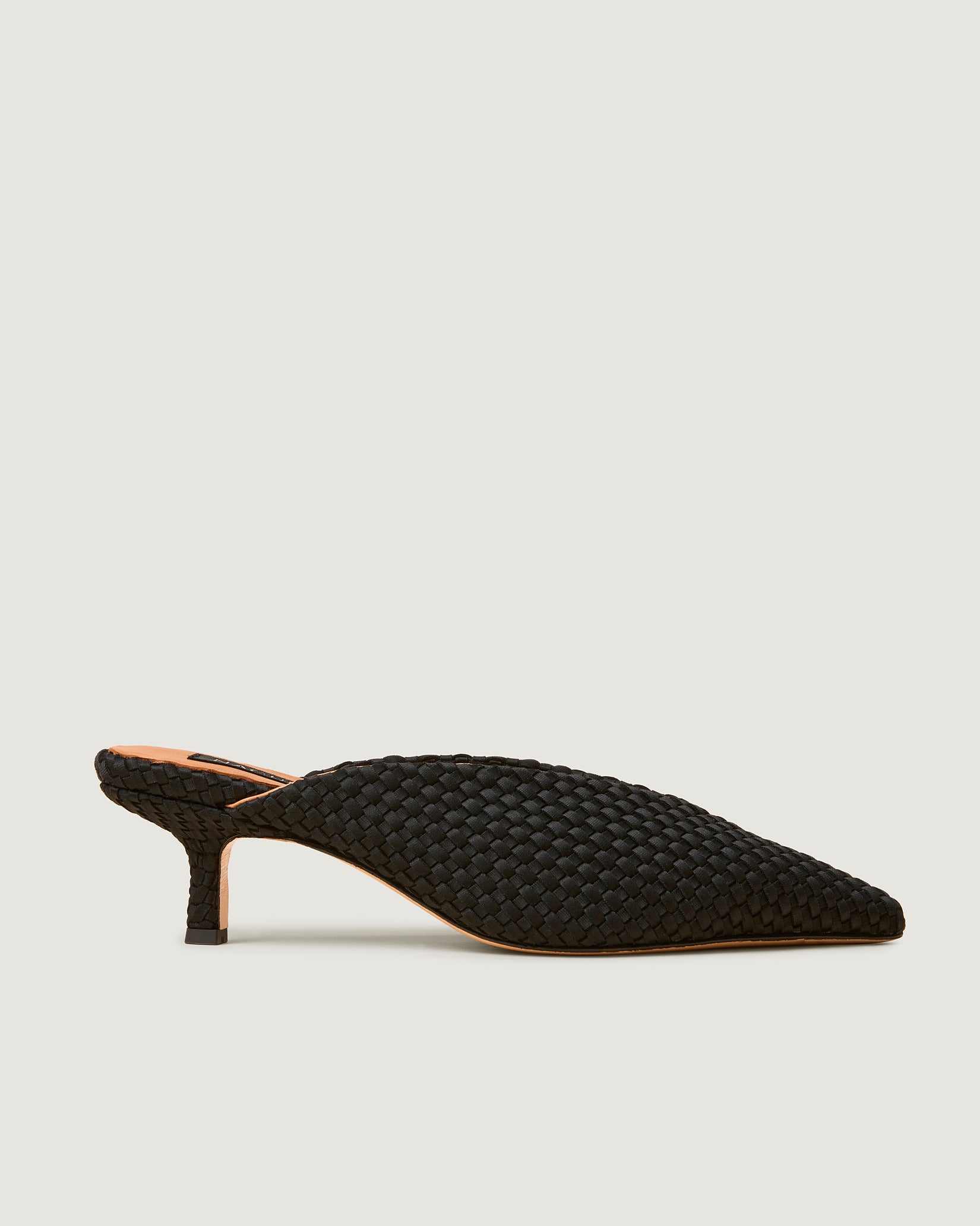 Side view of Strada Kitten Heel in Onyx, a true black tone, featuring a closed toe and pointed silhouette.