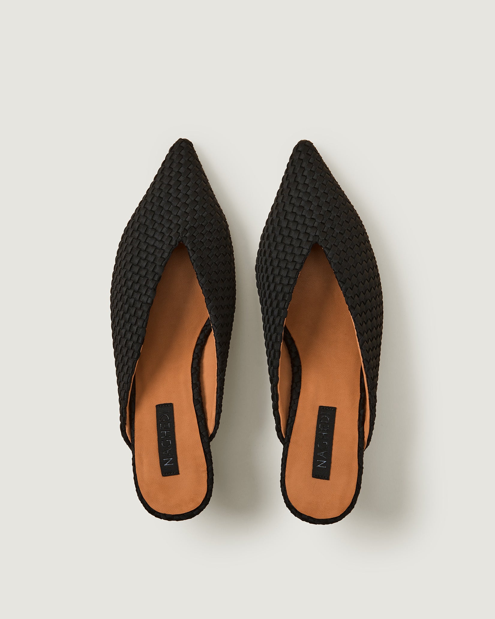 Top view of pair of Strada Kitten Heel in Onyx showing the handwoven neoprene insole.