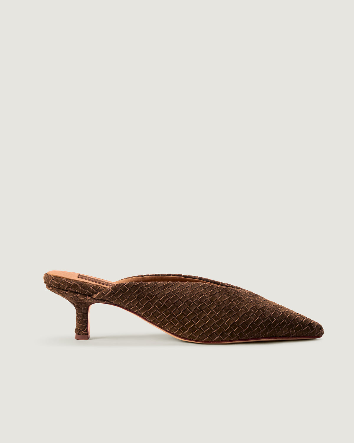 Side view of Strada in Teak, a saddle brown tone, featuring a closed toe and pointed silhouette.