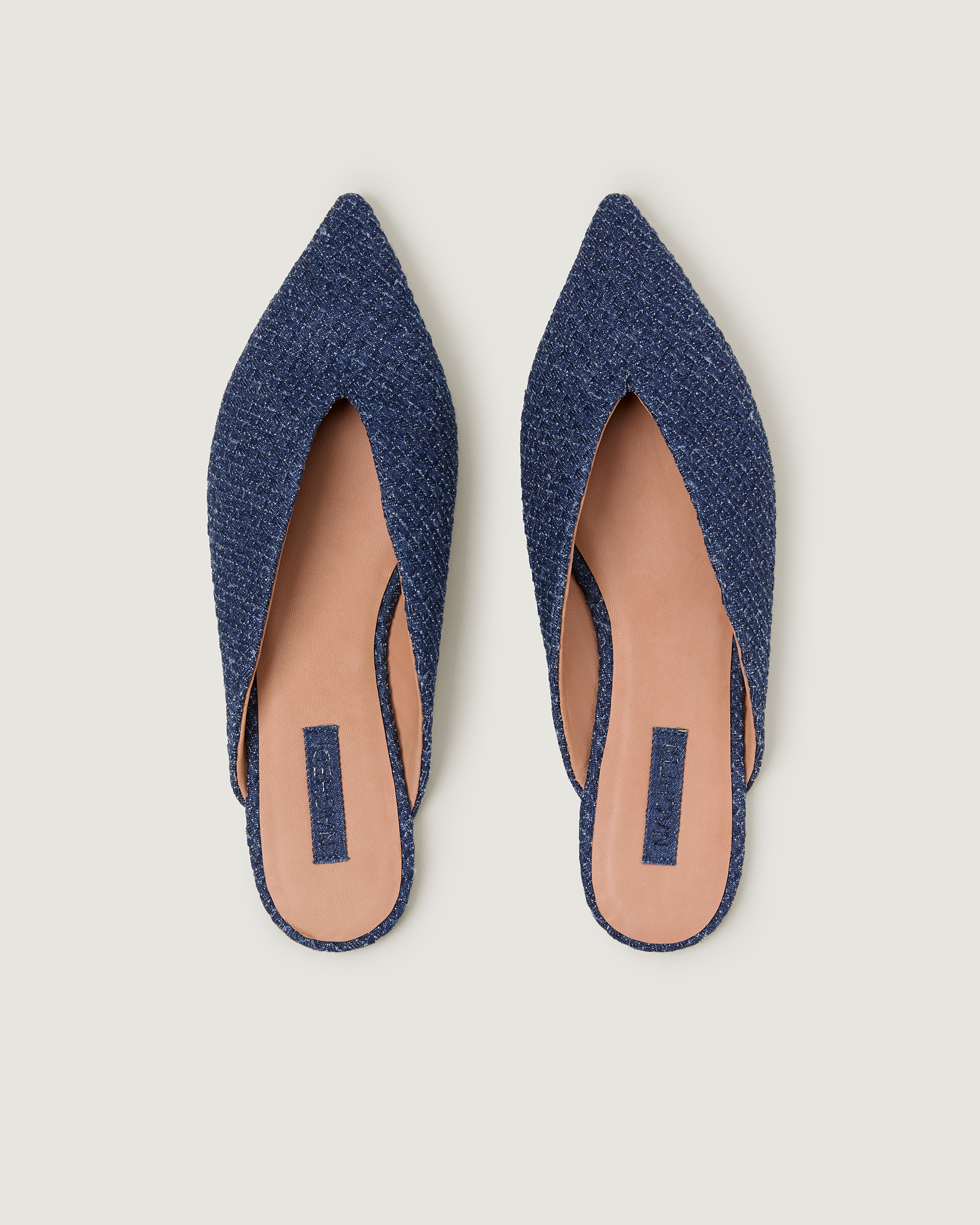 Top view of pair of Strada Mule in Denim showing the handwoven denim insole.