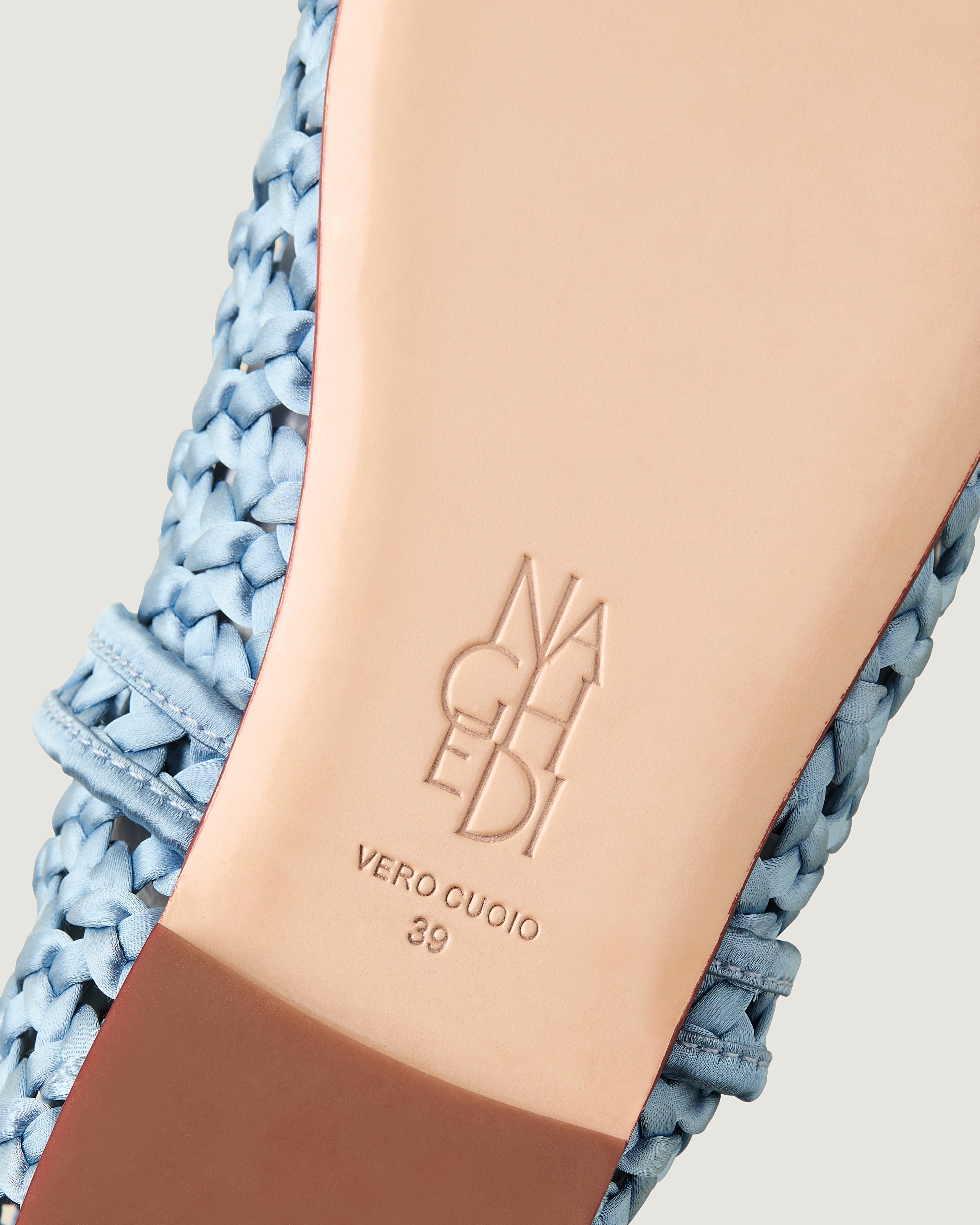 Shoe sole showing natural buffed leather sole, stamped NAGHEDI logo and size detail for The Sydney Mary Jane in Celeste.