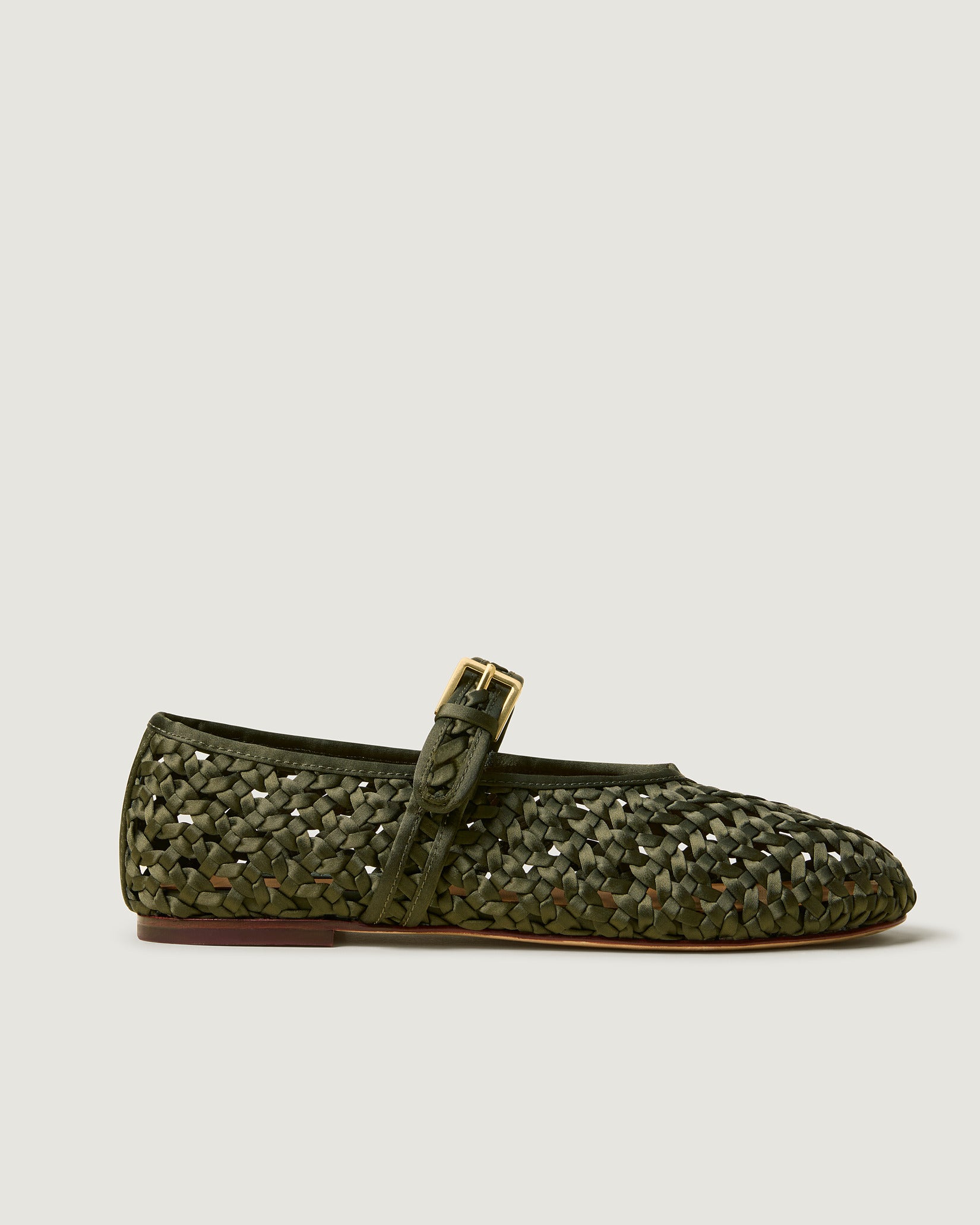 Side view of Sydney Satin Mary Jane Flats in Juniper, a forest green  tone, featuring a closed toe and round silhouette, featuring an adjustable strap with buckle closure.
