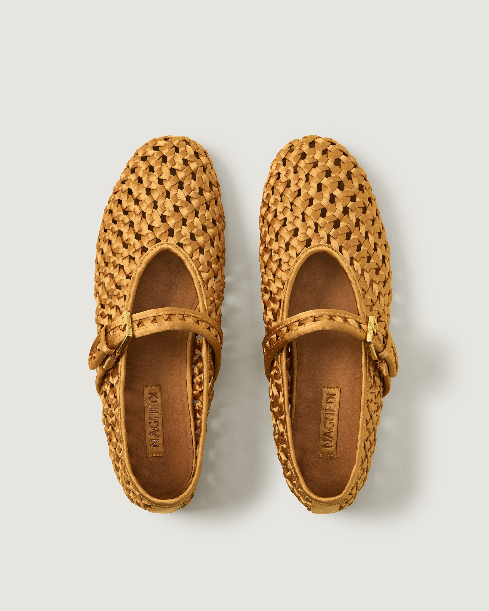 Top view of pair of Sydney Satin Mary Jane Flats in Ore showing the natural tanned leather insole.