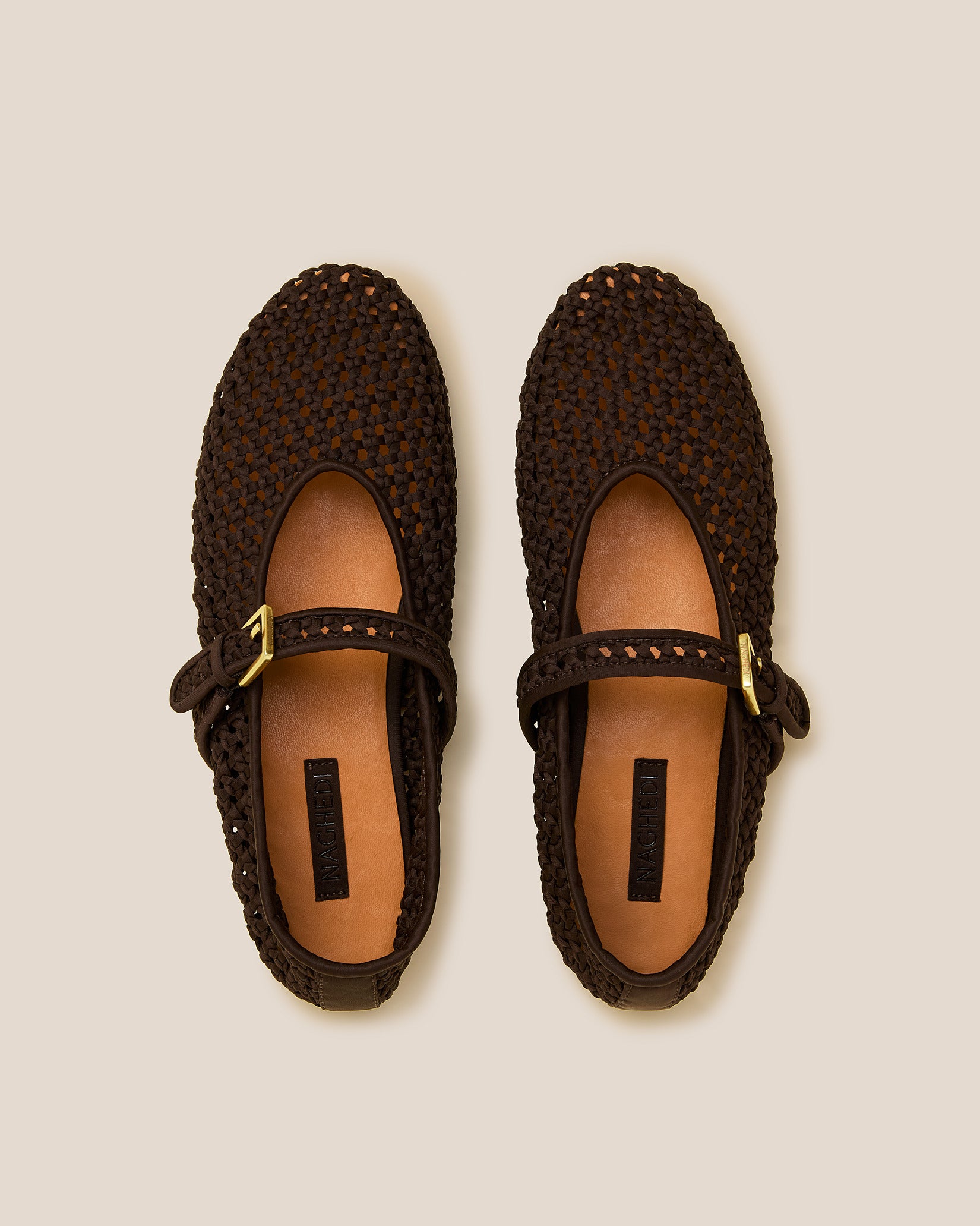 Top view of pair of Sydney Mary Jane Flats in Chocolate showing the natural tanned leather insole.