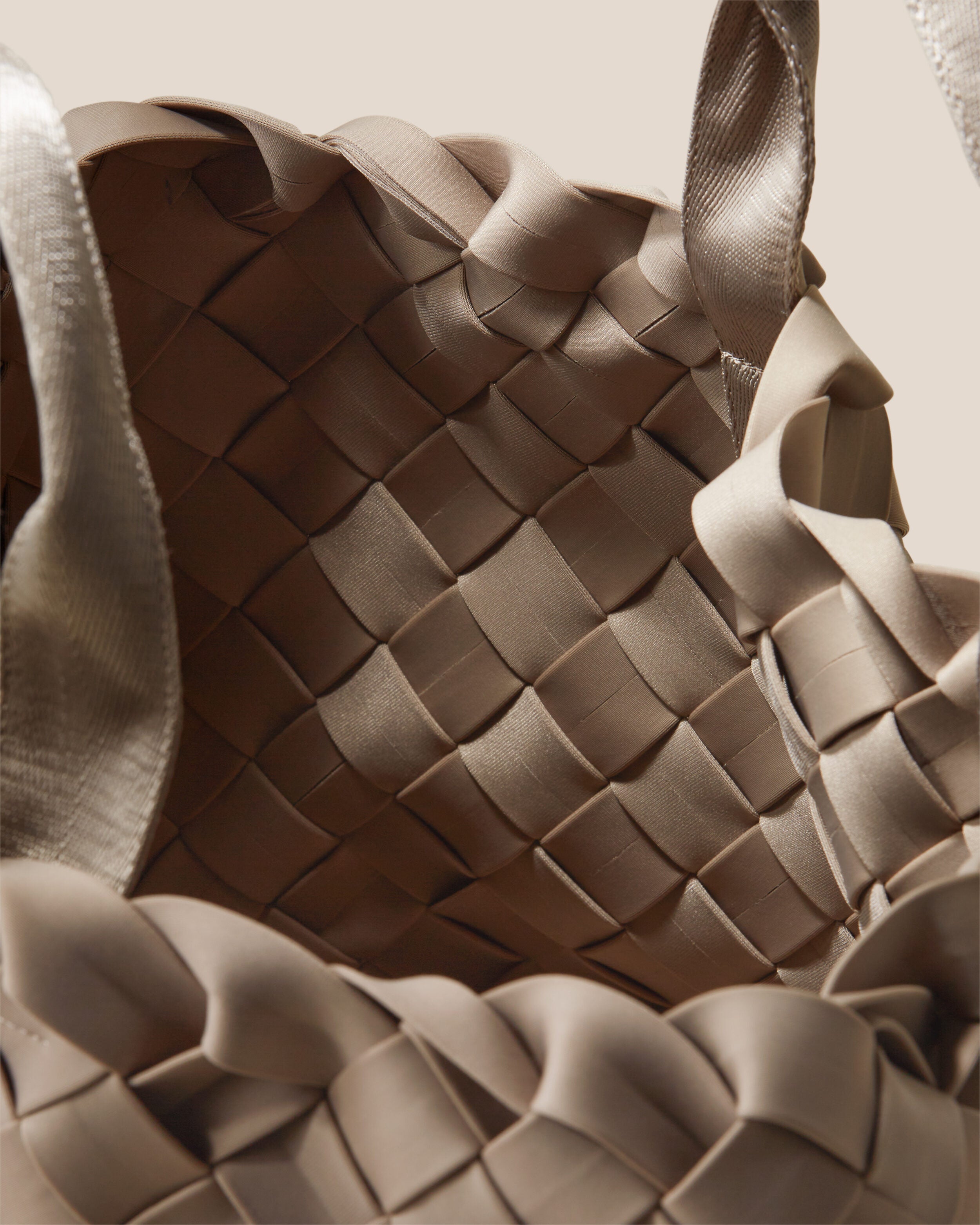 Interior close-up of Tangier Tote in Cashmere showing its open top, and unlined interior.