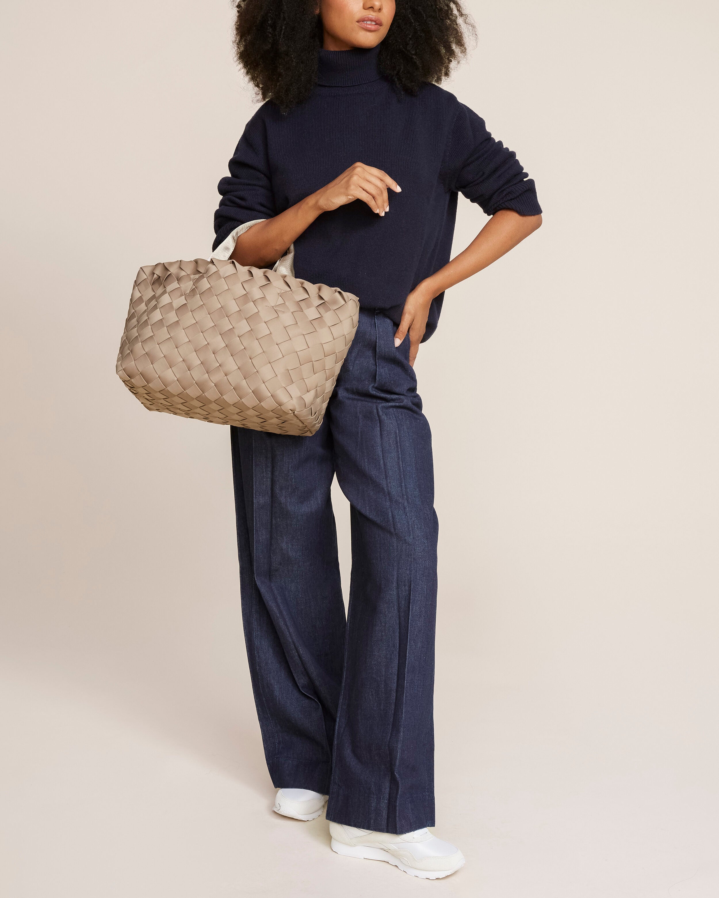 Tangier Tote in Cashmere shown on model to illustrate scale and soft silhouette.