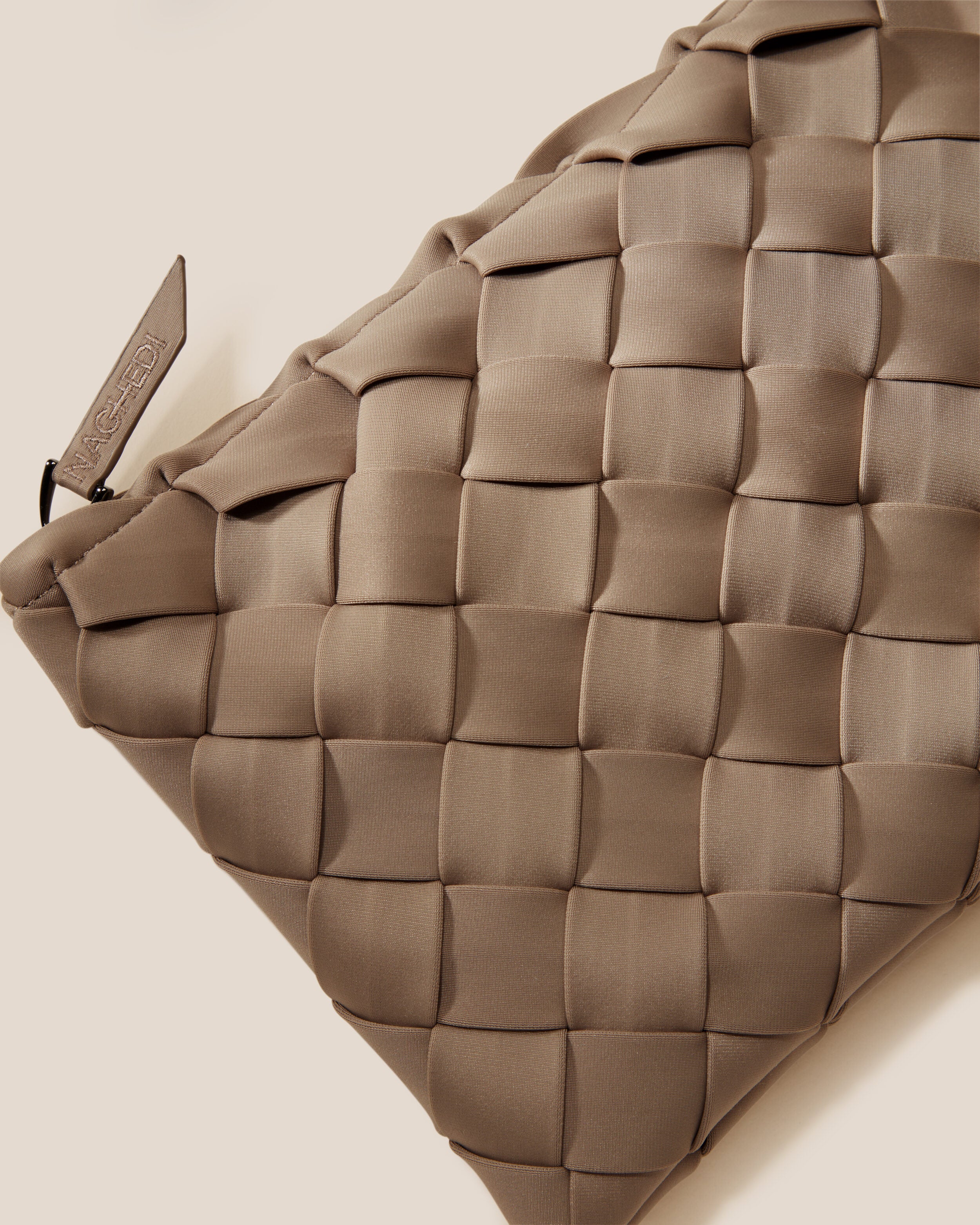 Close-up of included matching woven zippered pouch.