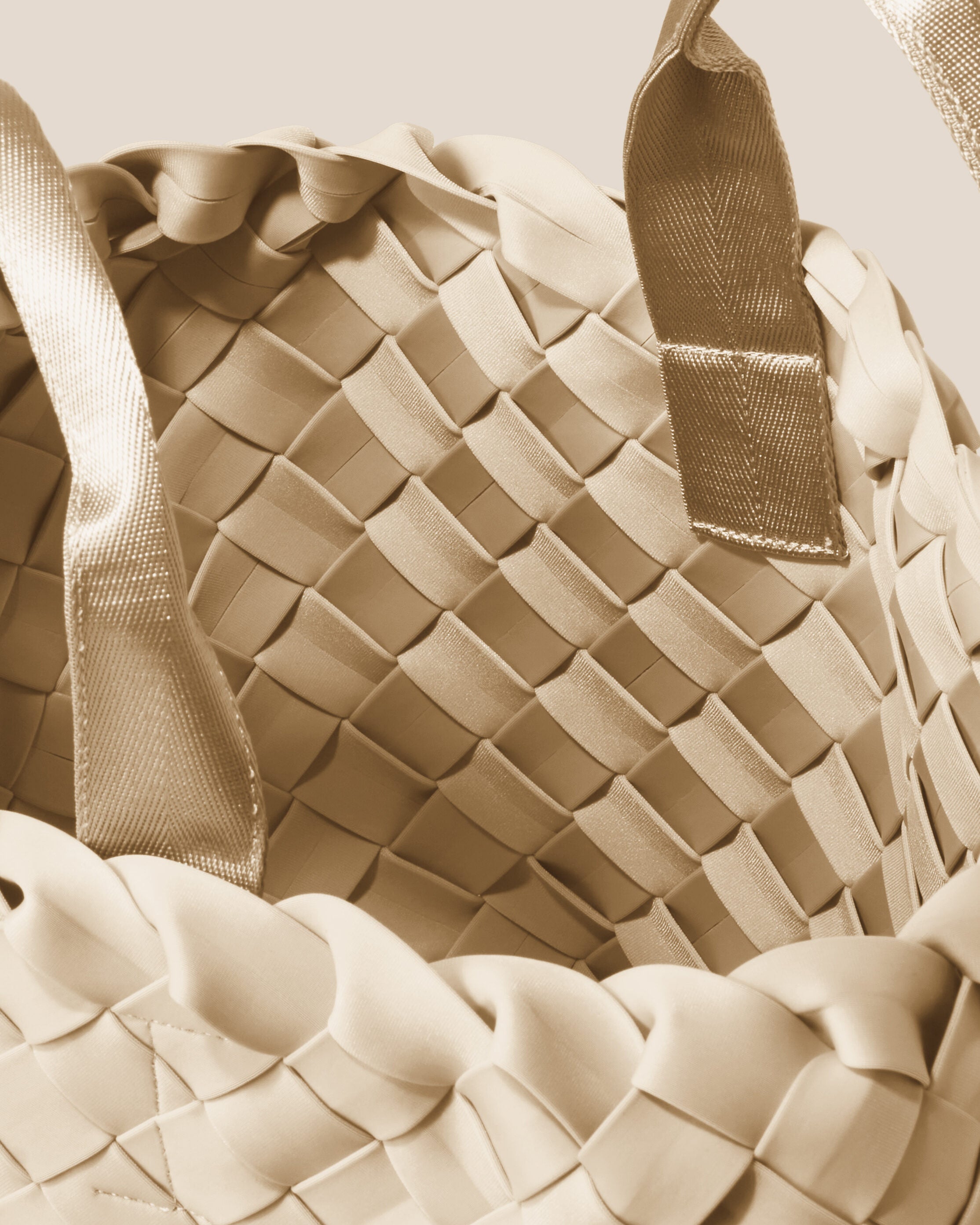 Interior close-up of Tangier Tote in Ecru showing its open top, and unlined interior.