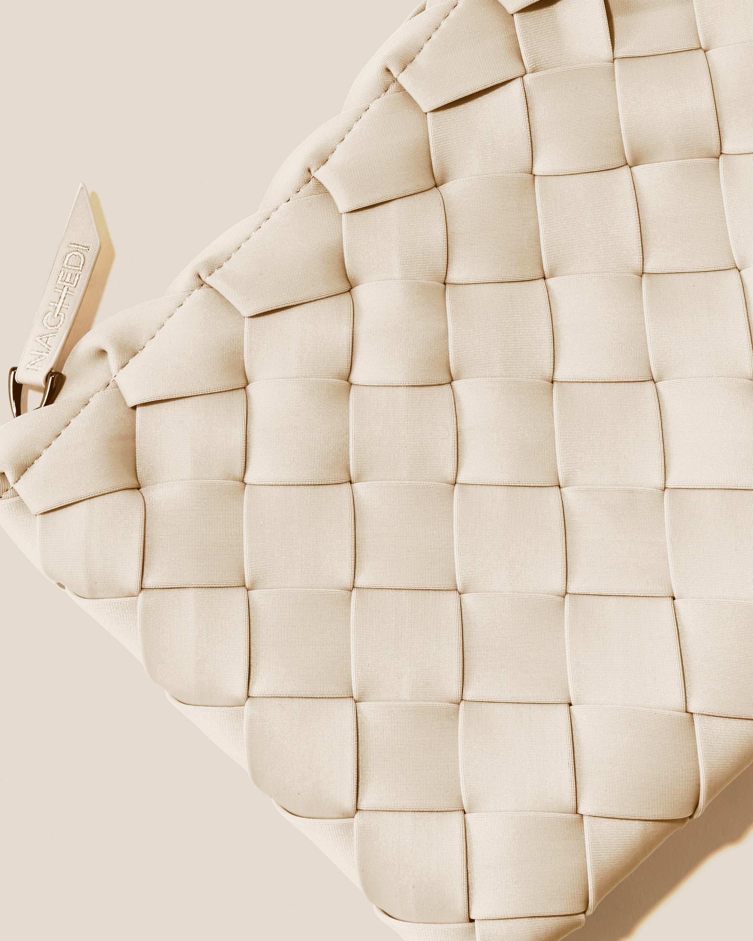 Close-up of included matching woven zippered pouch.