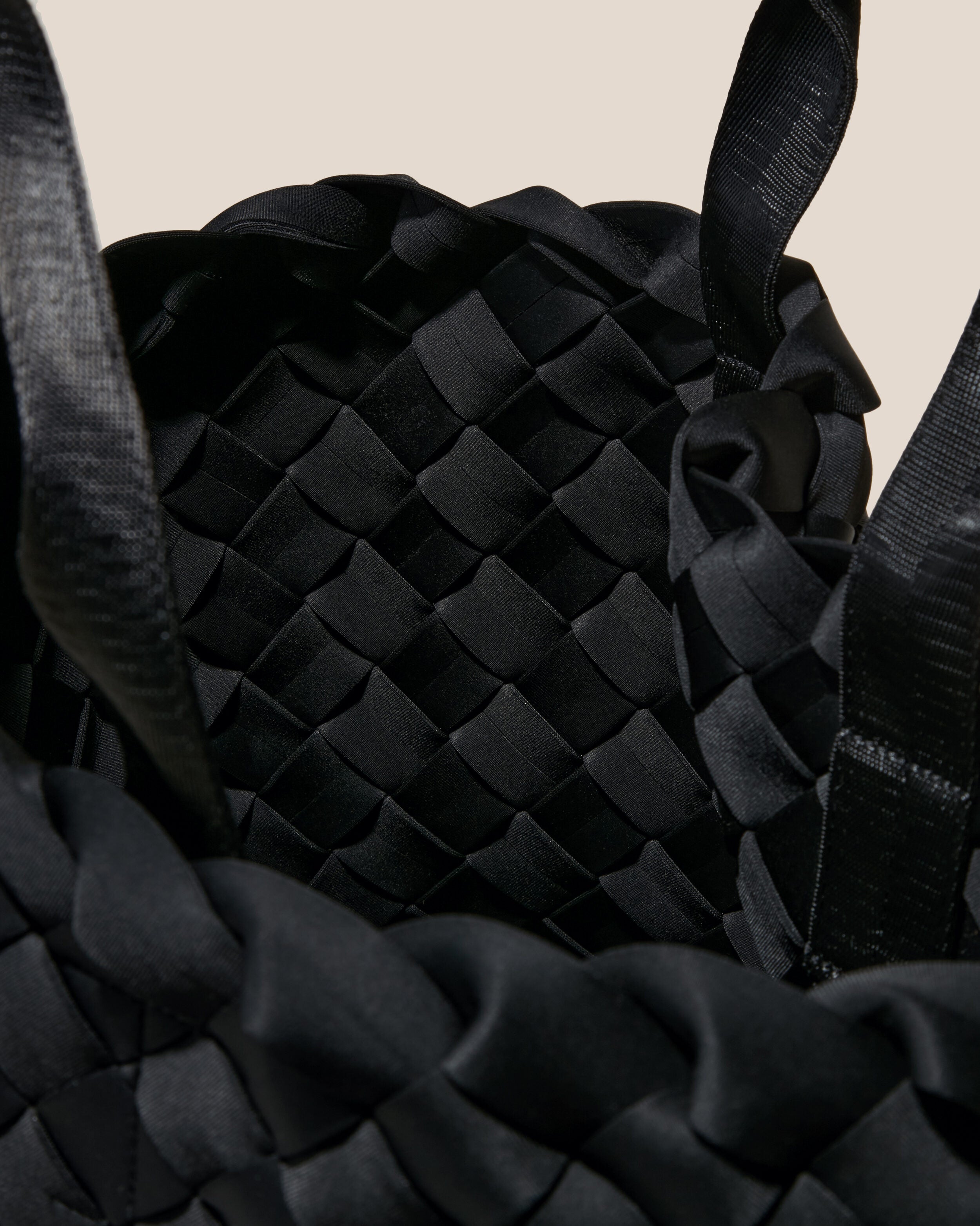 Interior close-up of Tangier Tote in Onyx showing its open top, and unlined interior.