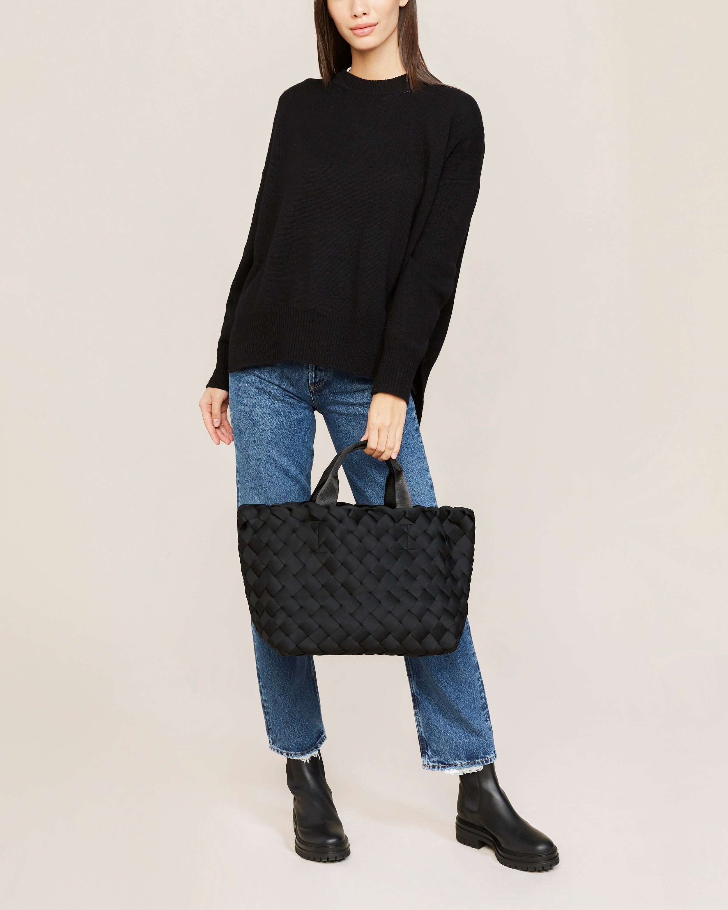 Tangier Tote in Onyx shown on model to illustrate scale and soft silhouette.