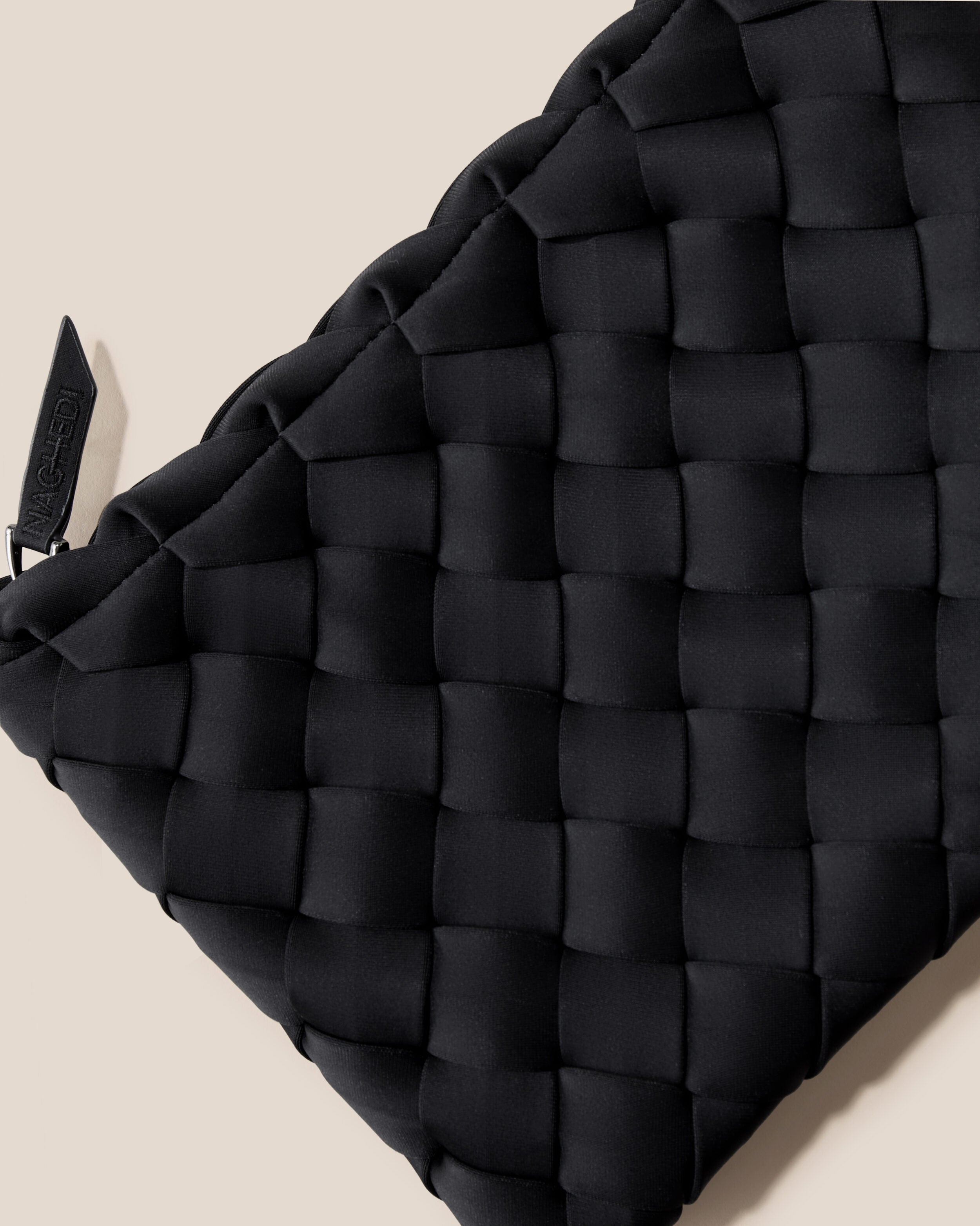 Close-up of included matching woven zippered pouch.