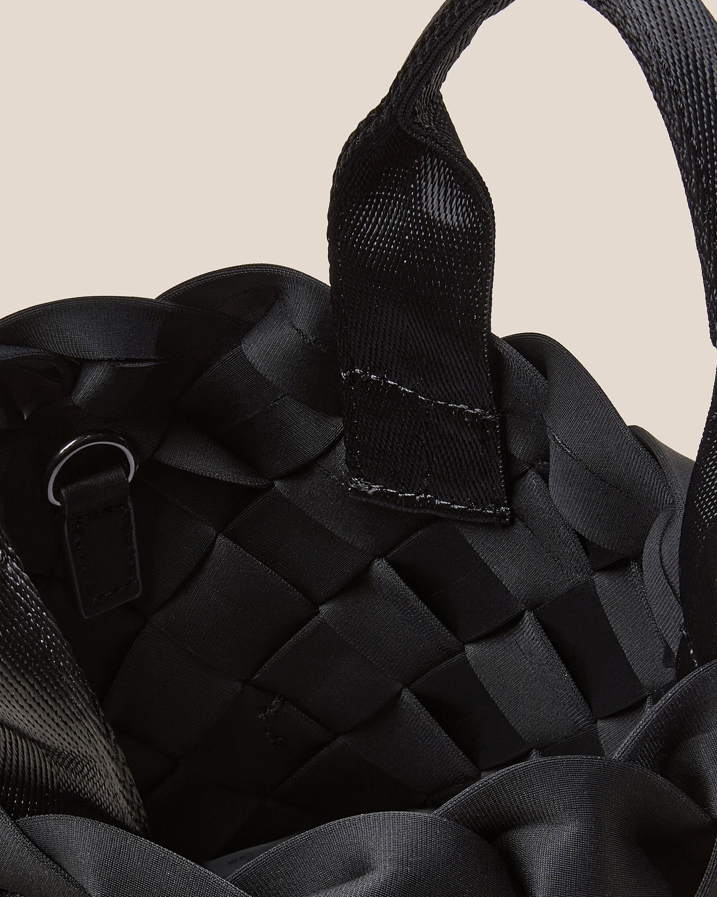 Interior close-up of Tangier Tote in Onyx showing its open top, and unlined interior.