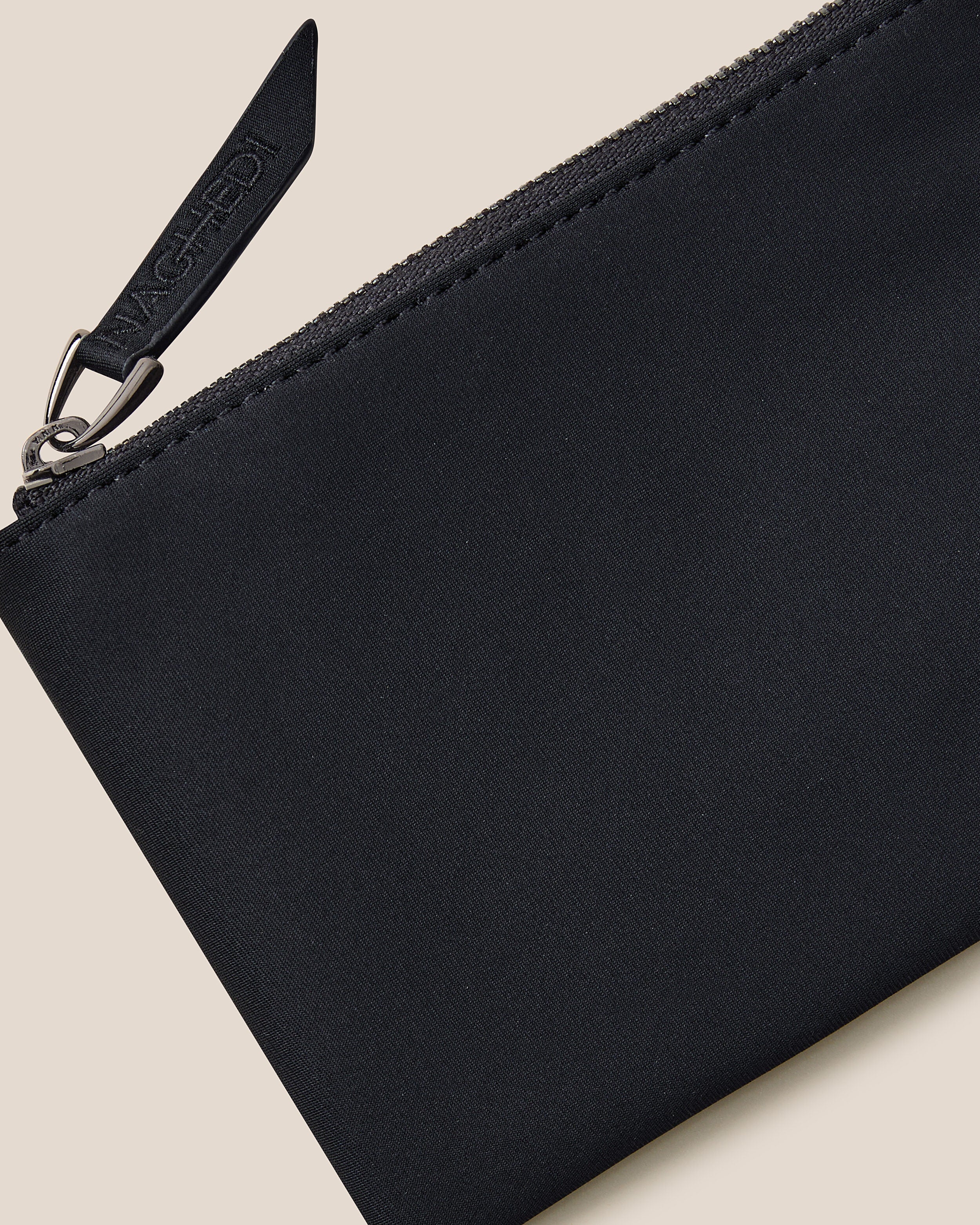 Close-up of included coordinating neoprene zippered pouch.