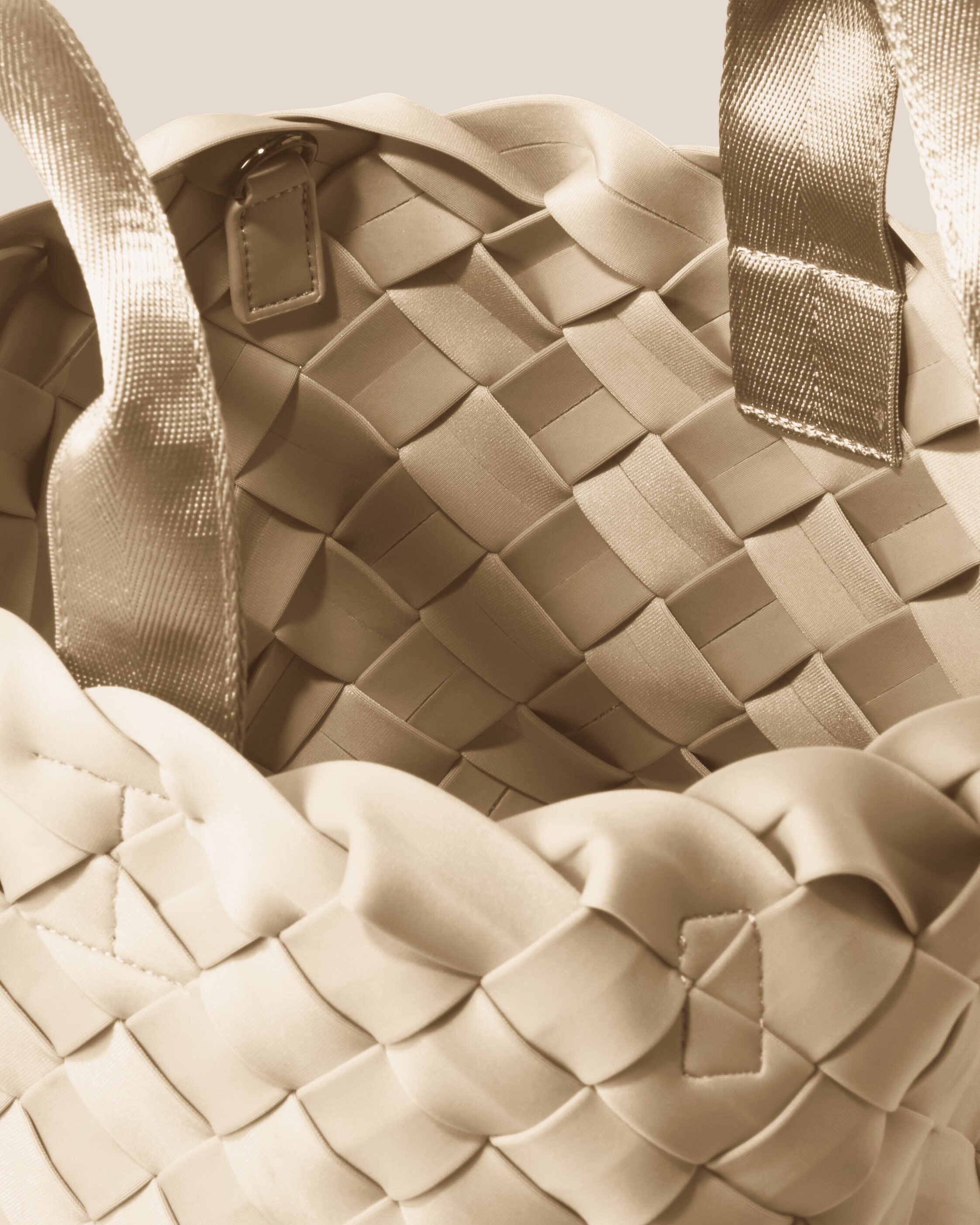 Interior close-up of Tangier Tote in Ecru showing its open top, and unlined interior.