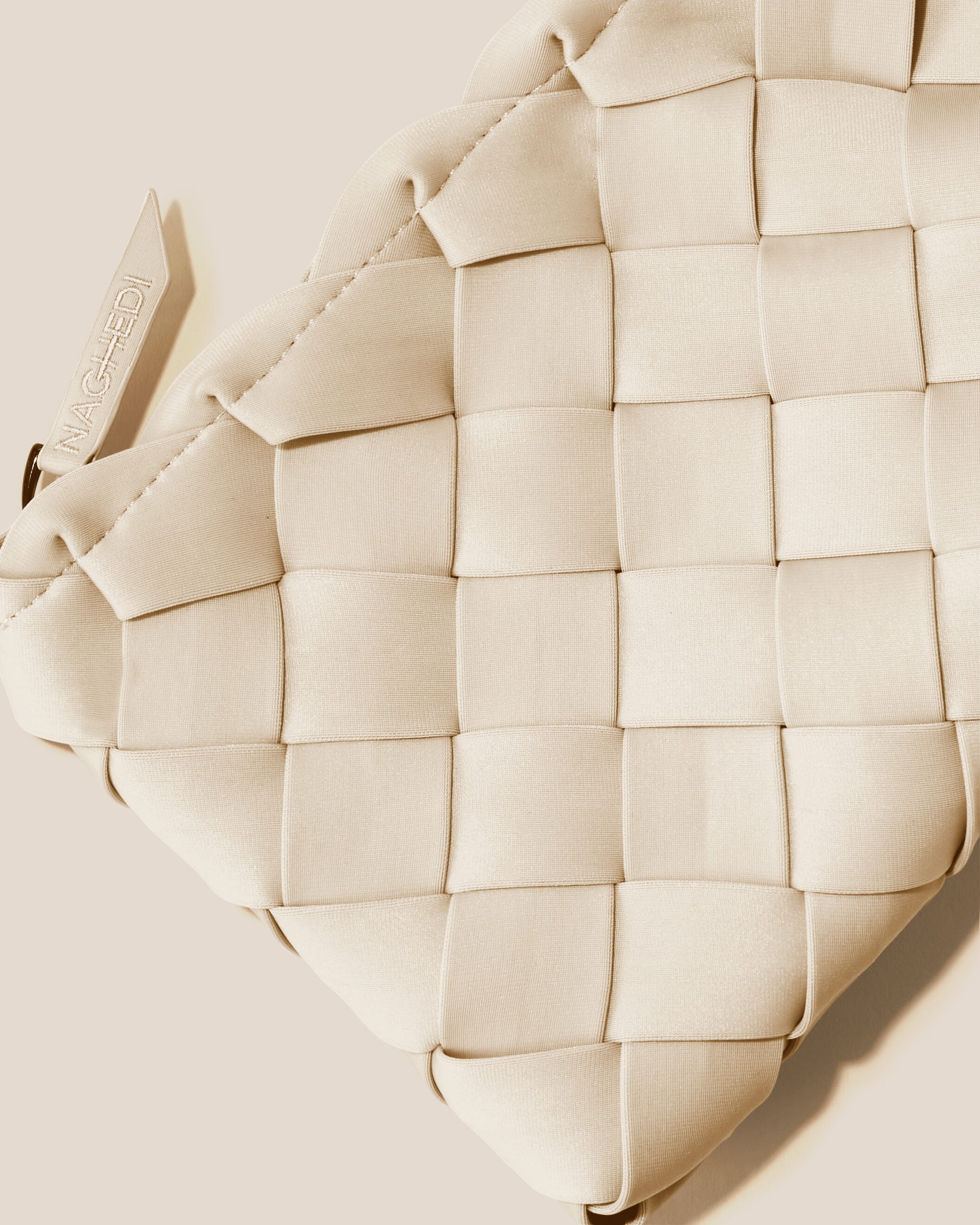 Close-up of included matching woven zippered pouch.