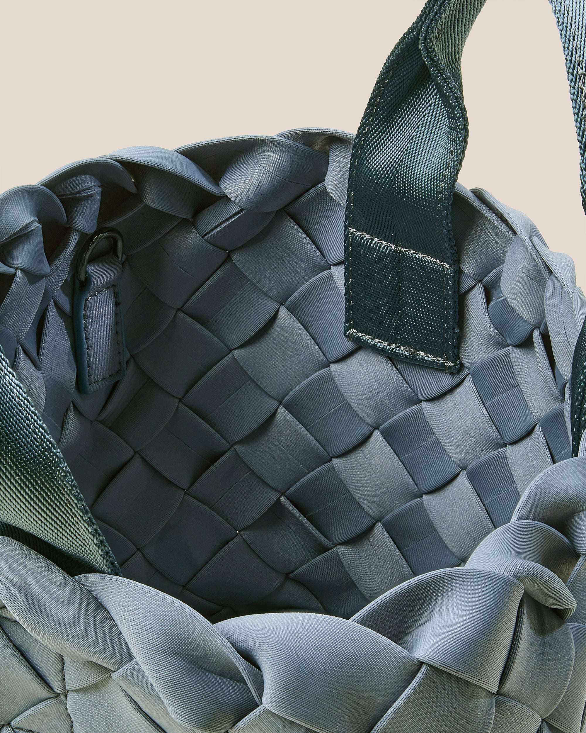 Interior close-up of Tangier Tote in Nova showing its open top, and unlined interior.