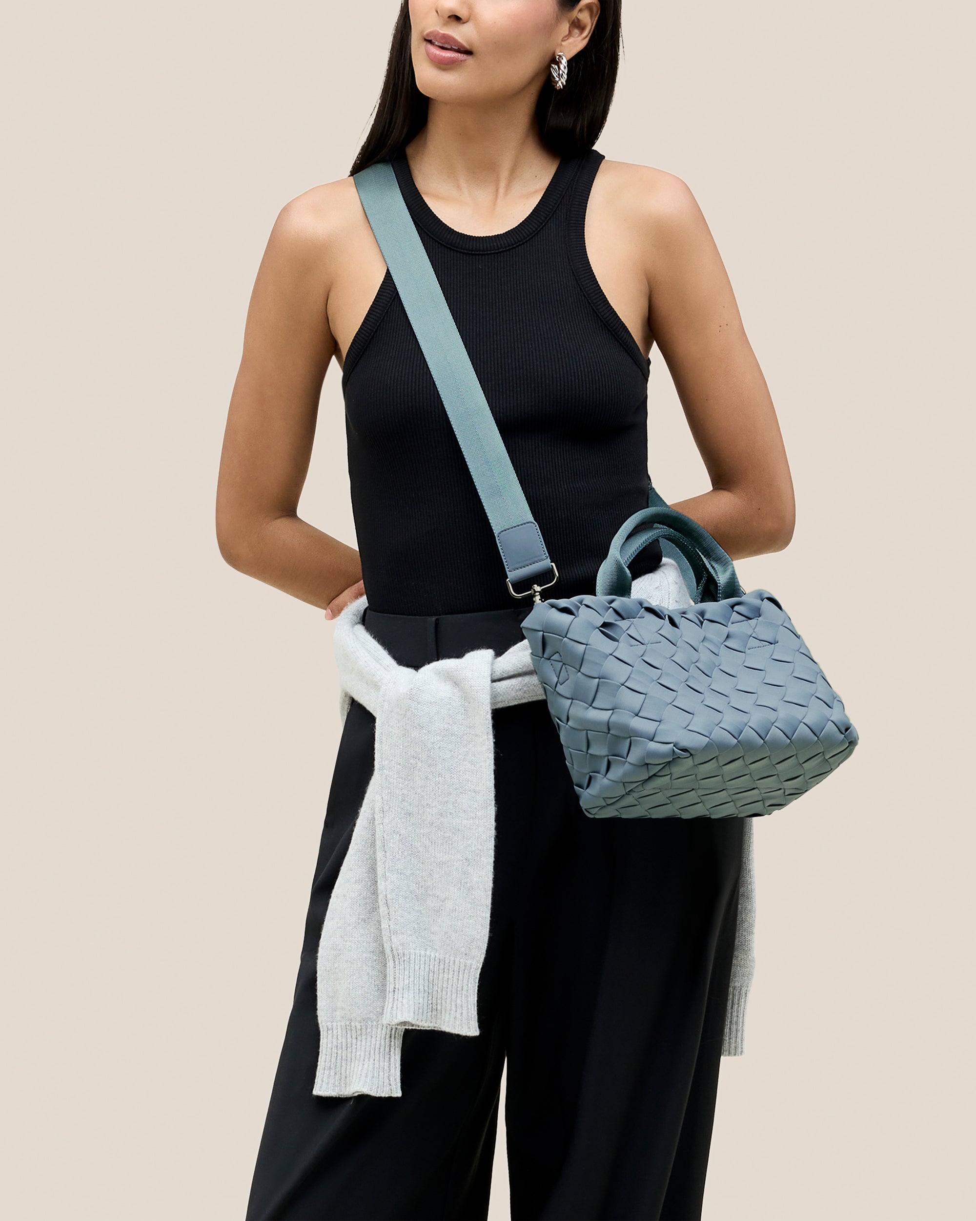 Tangier Tote in Nova shown on model to illustrate scale and soft silhouette.