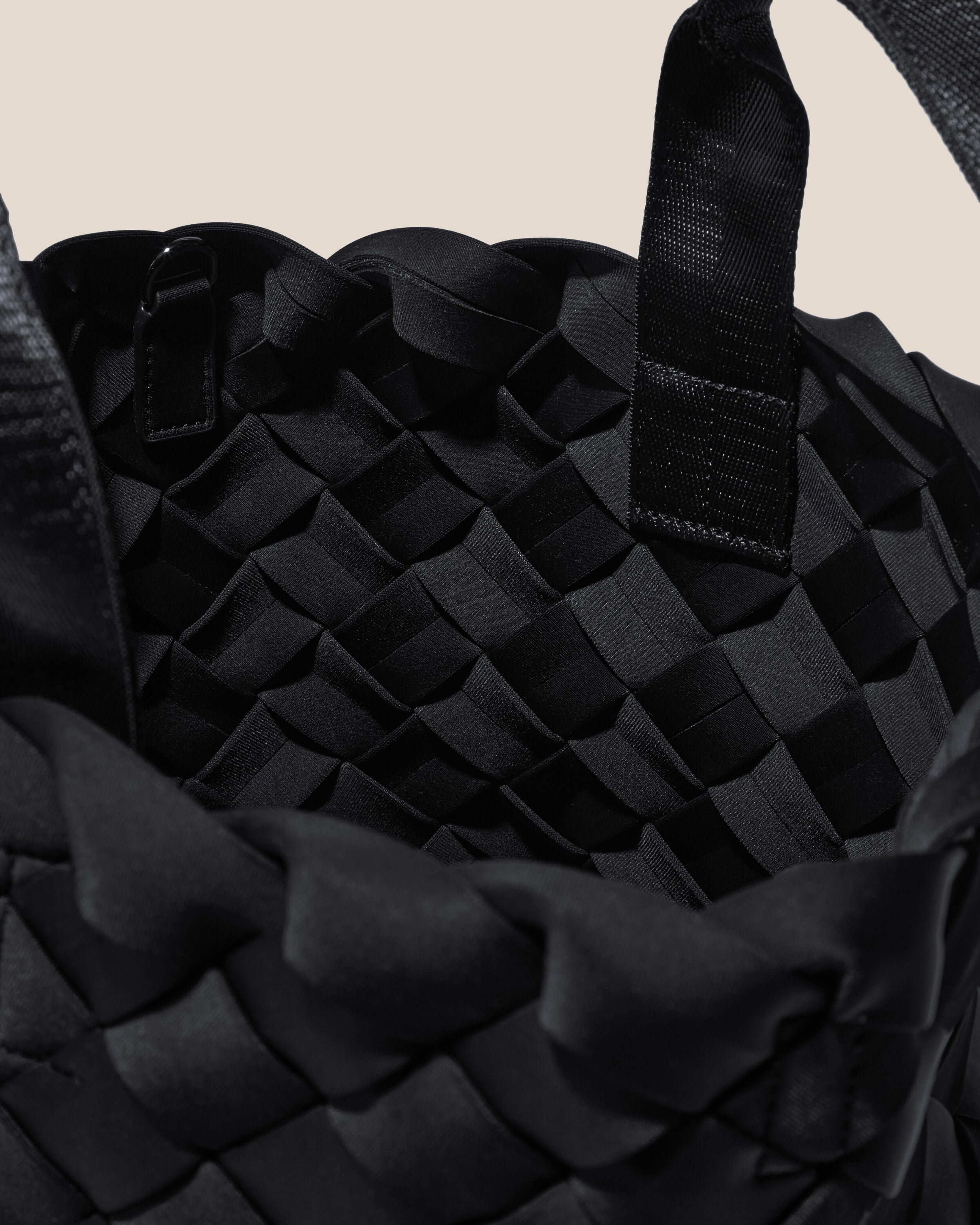 Interior close-up of Tangier Tote in Onyx showing its open top, and unlined interior.