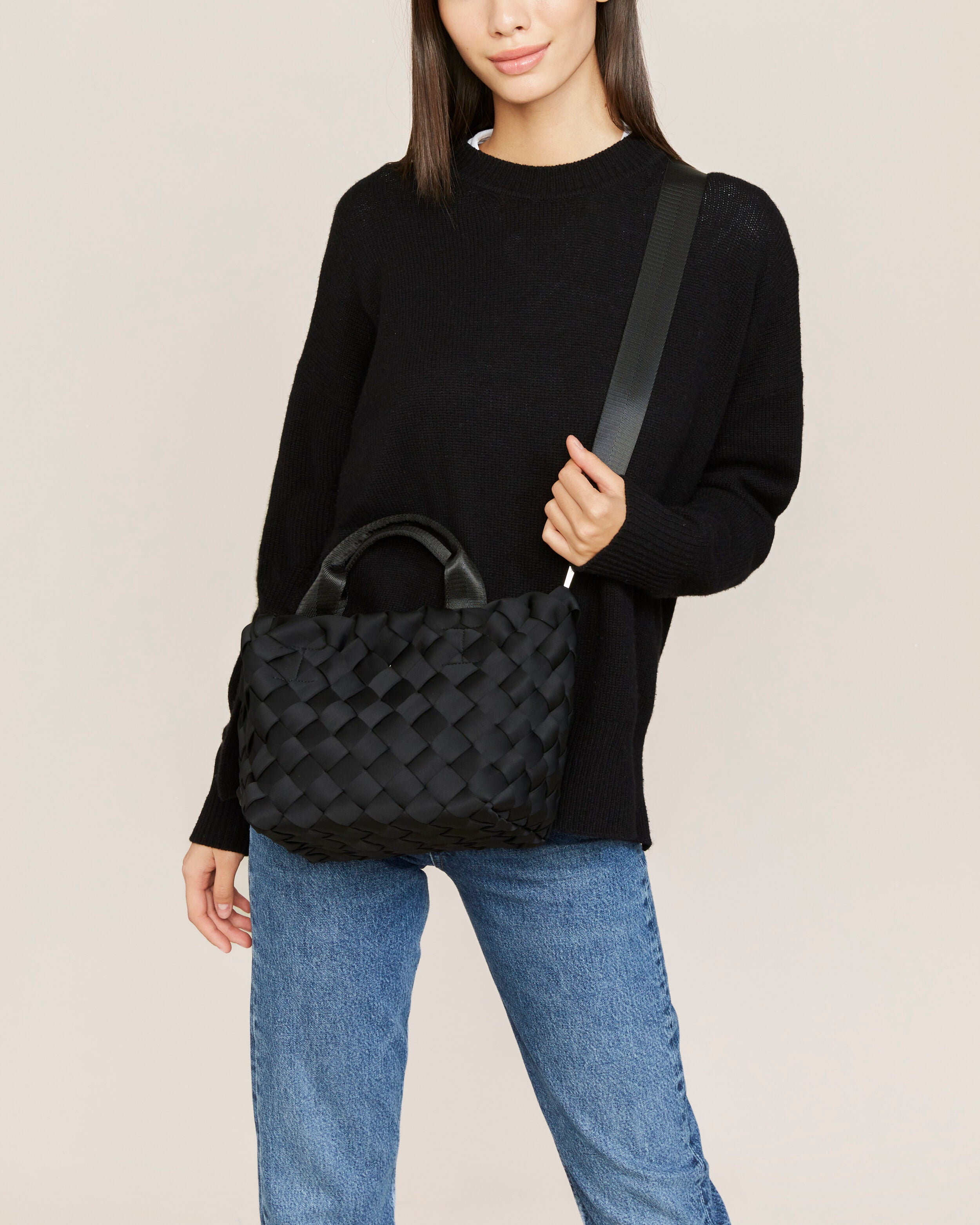Tangier Tote in Onyx shown on model to illustrate scale and soft silhouette.