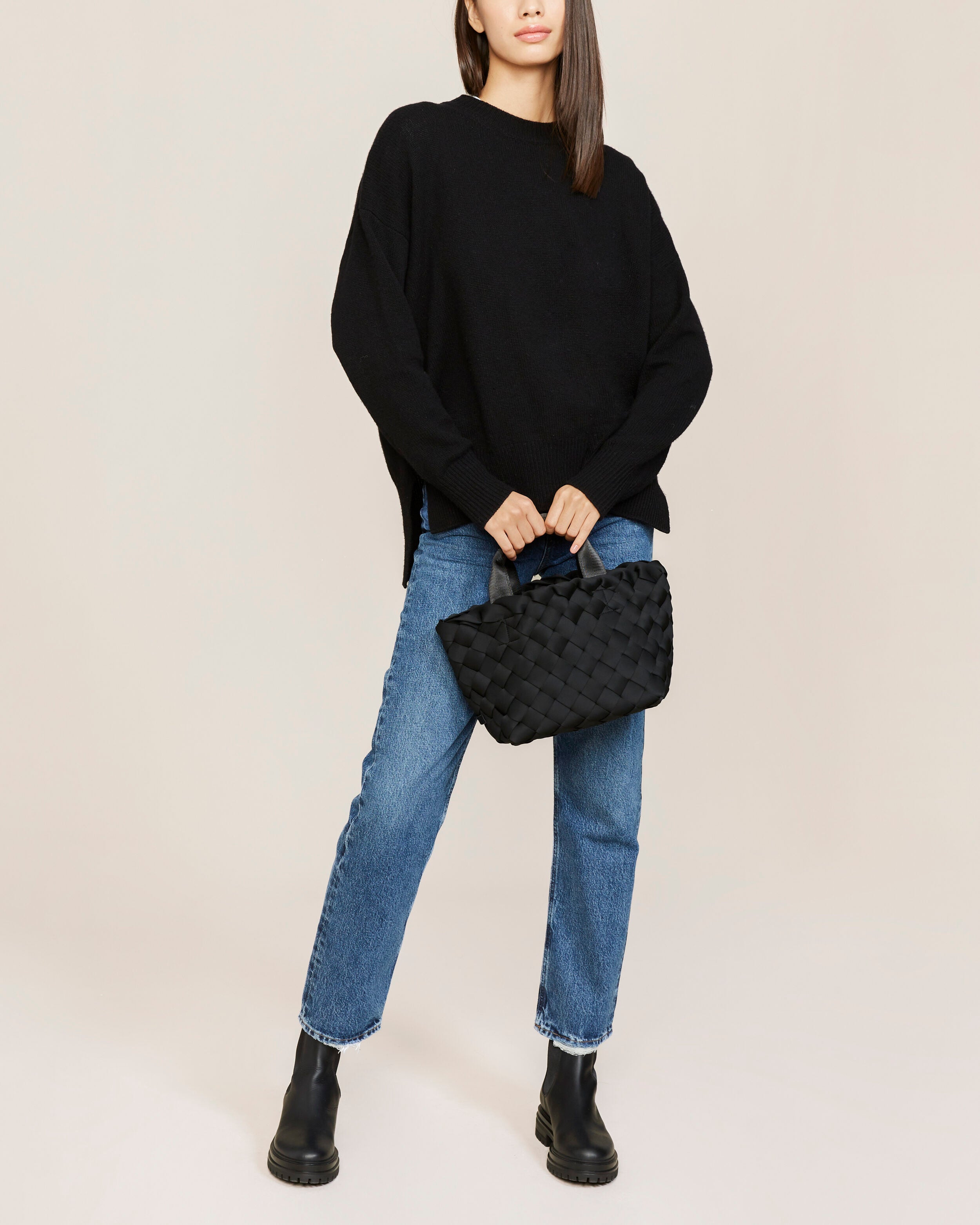 Tangier Tote in Onyx shown on model to illustrate scale and soft silhouette.