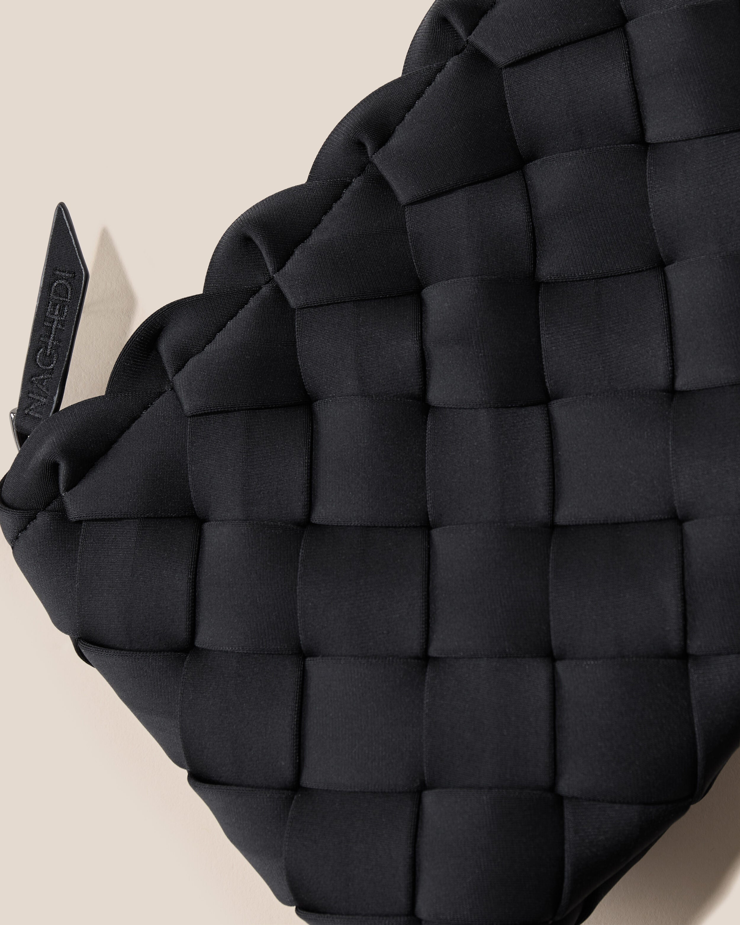 Close-up of included matching woven zippered pouch.