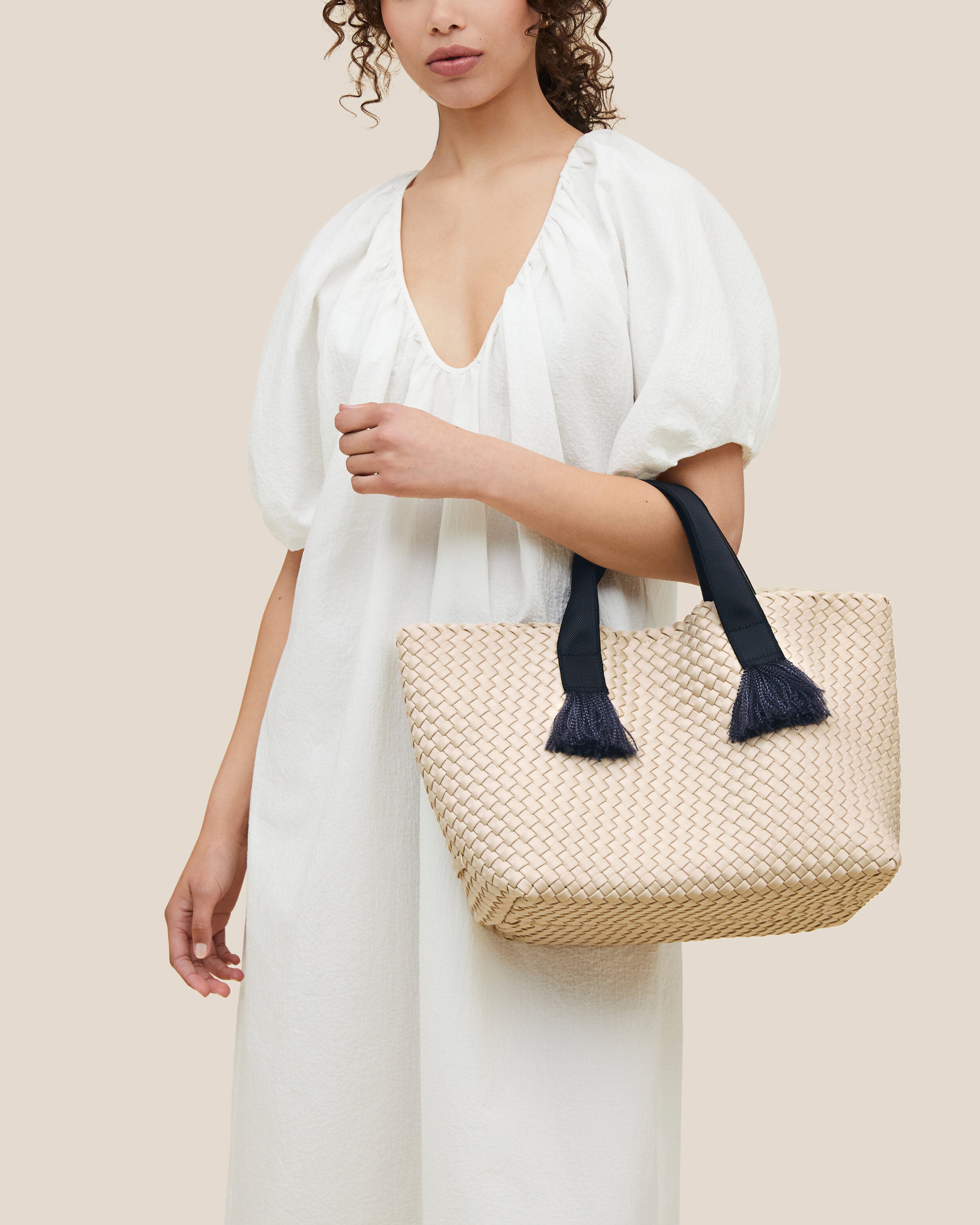 Tulum Tote in Moon shown on model to illustrate scale and soft silhouette.