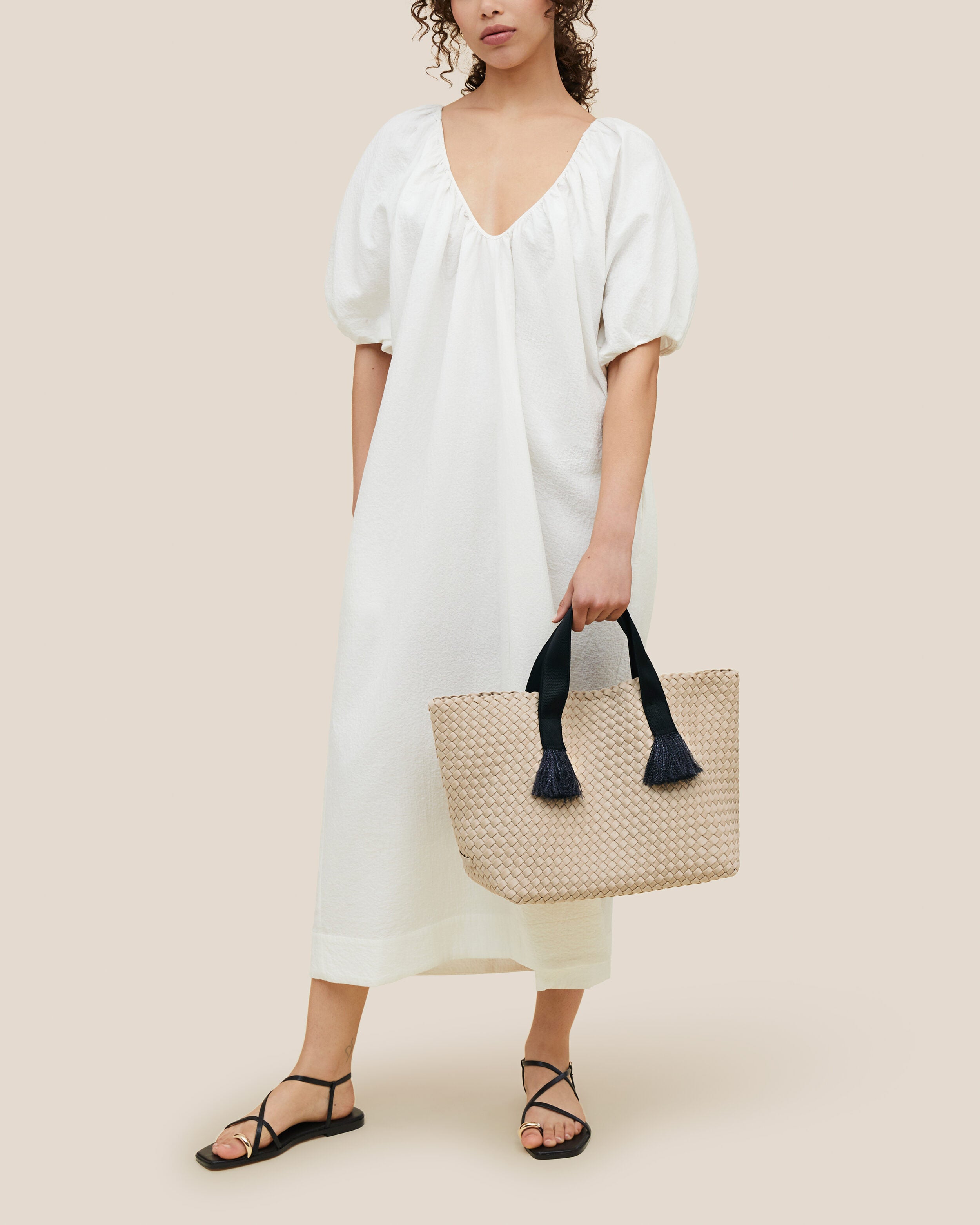 Tulum Tote in Moon shown on model to illustrate scale and soft silhouette.