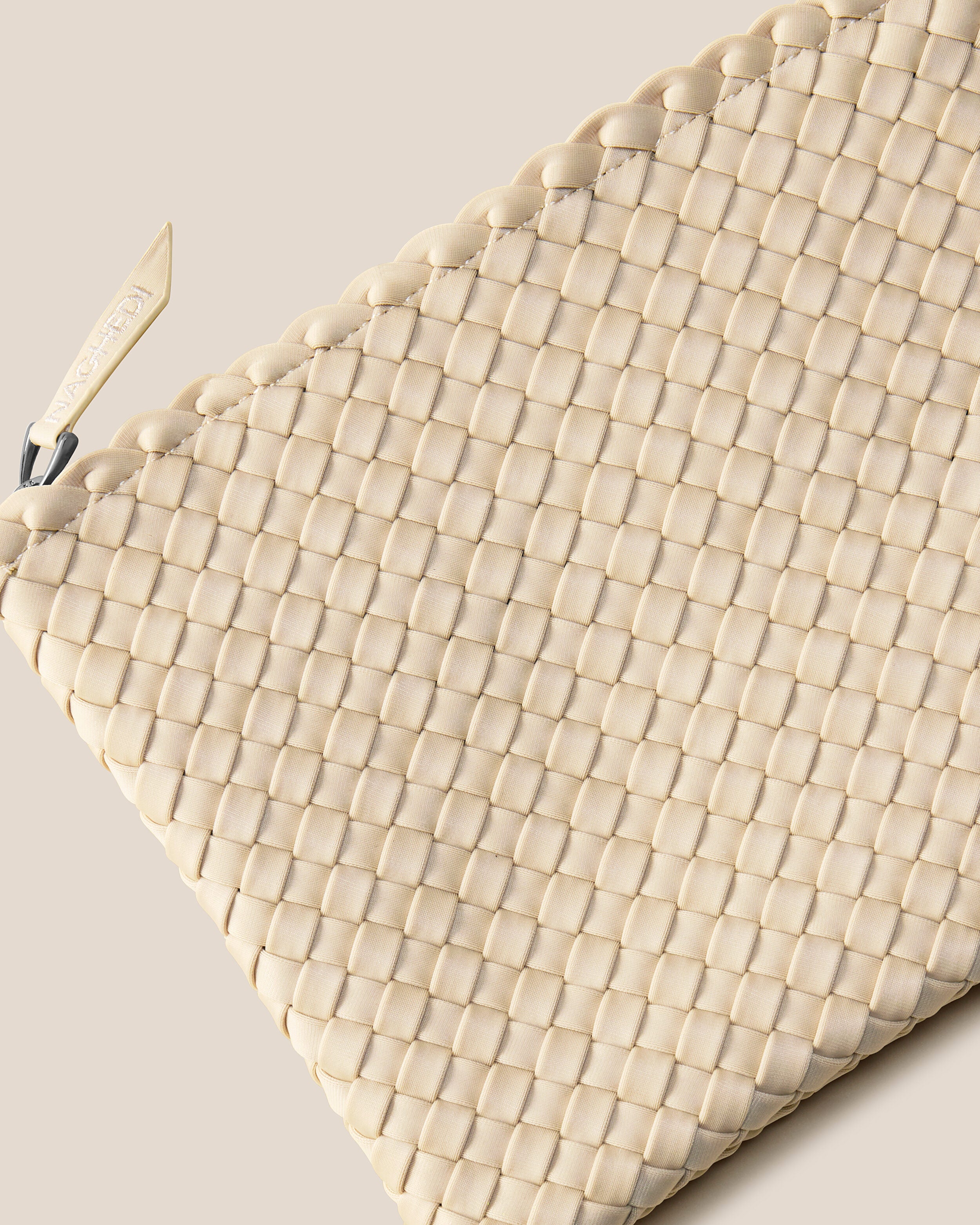 Close-up of included matching woven neoprene zippered pouch.