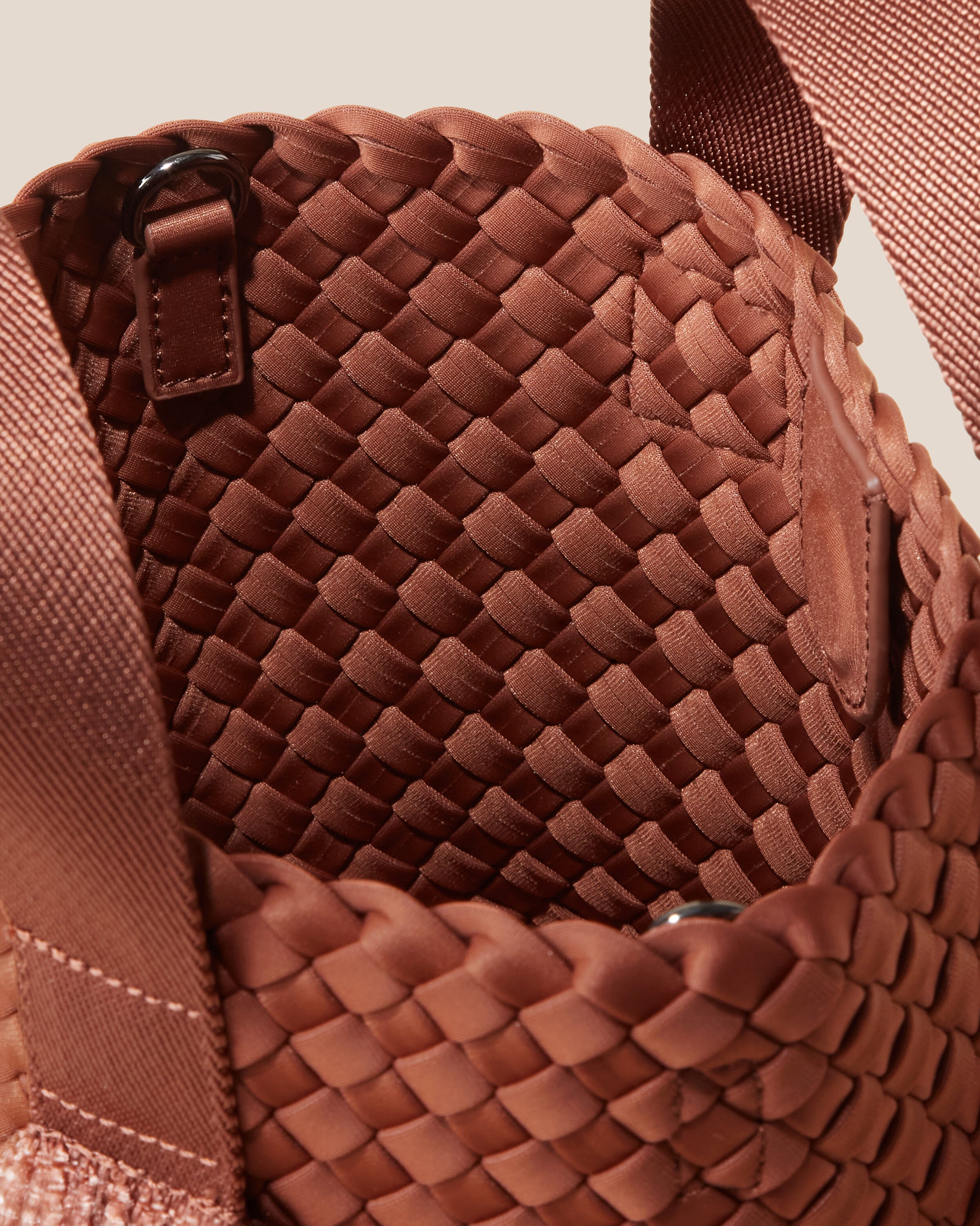 Interior close-up of Tulum Tote in Adobe showing its open top with magnetic snap closure, and unlined interior.