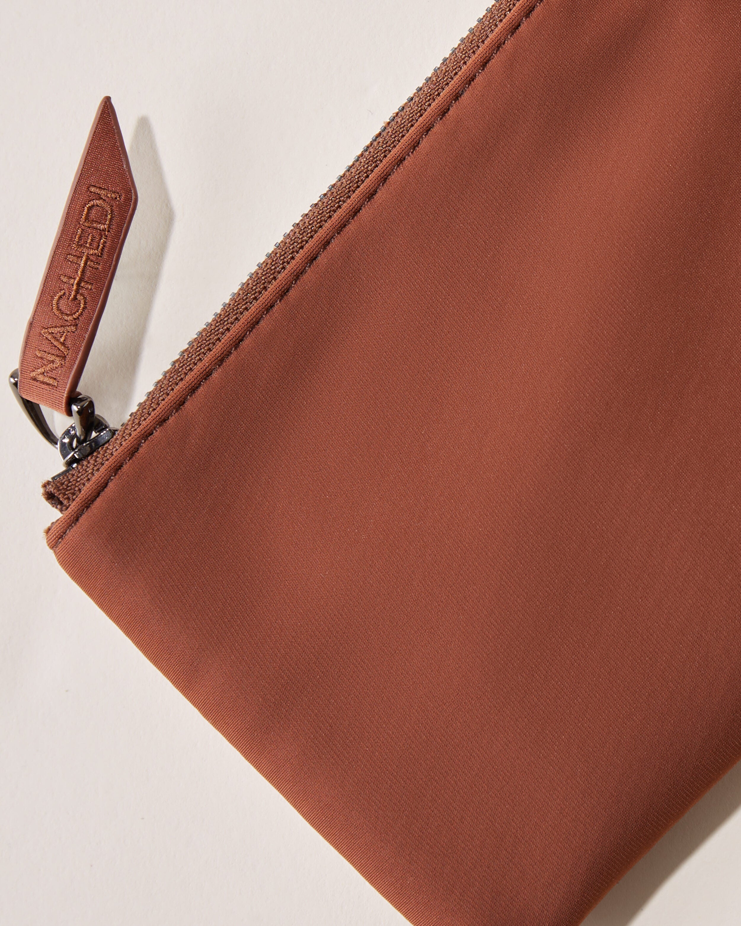 Close-up of included coordinating neoprene zippered pouch.