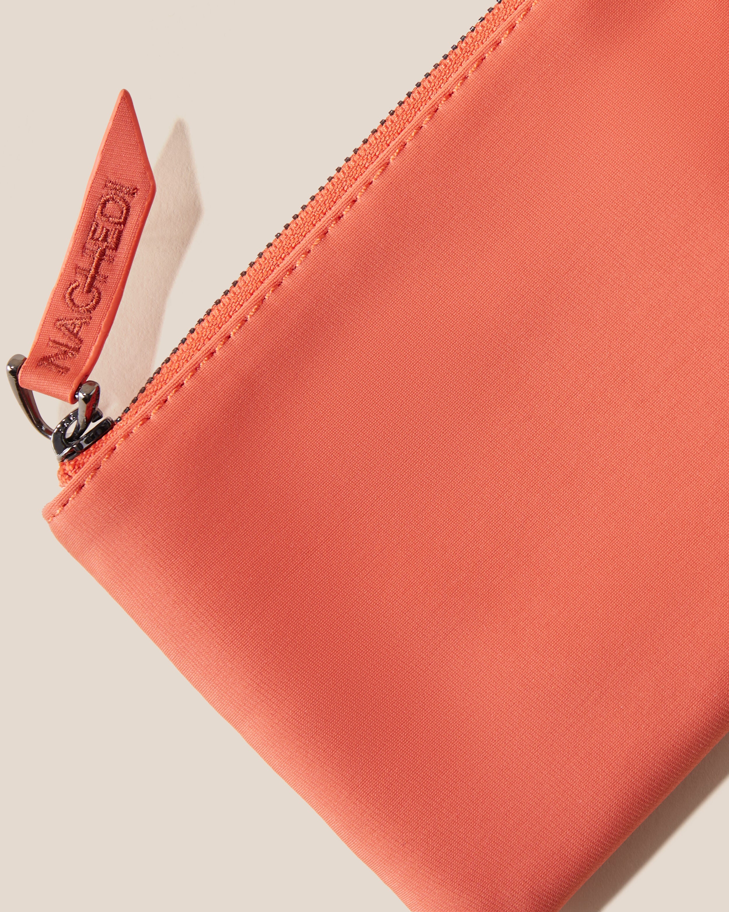 Close-up of included coordinating neoprene zippered pouch.